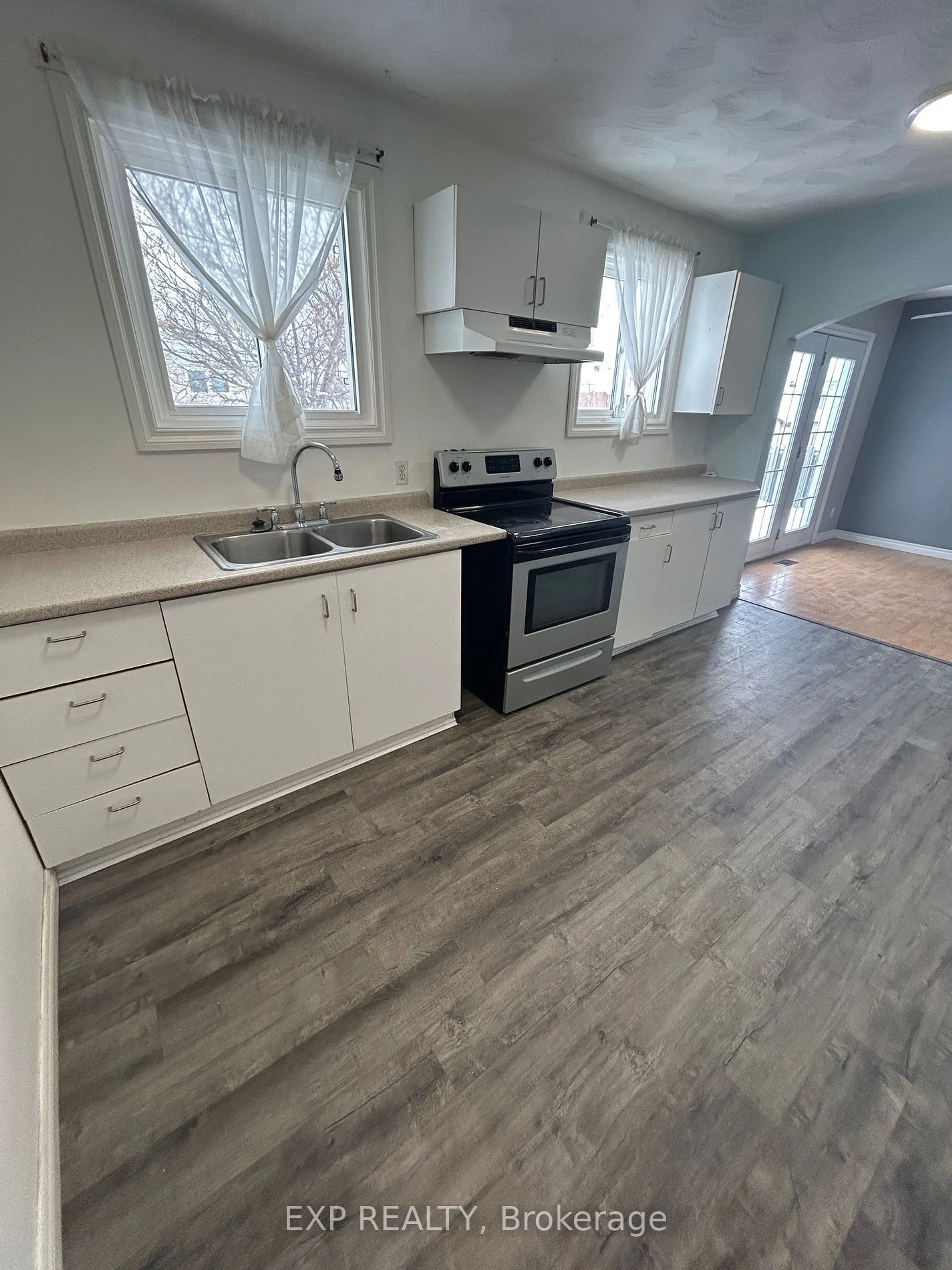 Open concept kitchen, wood/laminate floor for 470 Randall Dr, Timmins Ontario P4N 7V3