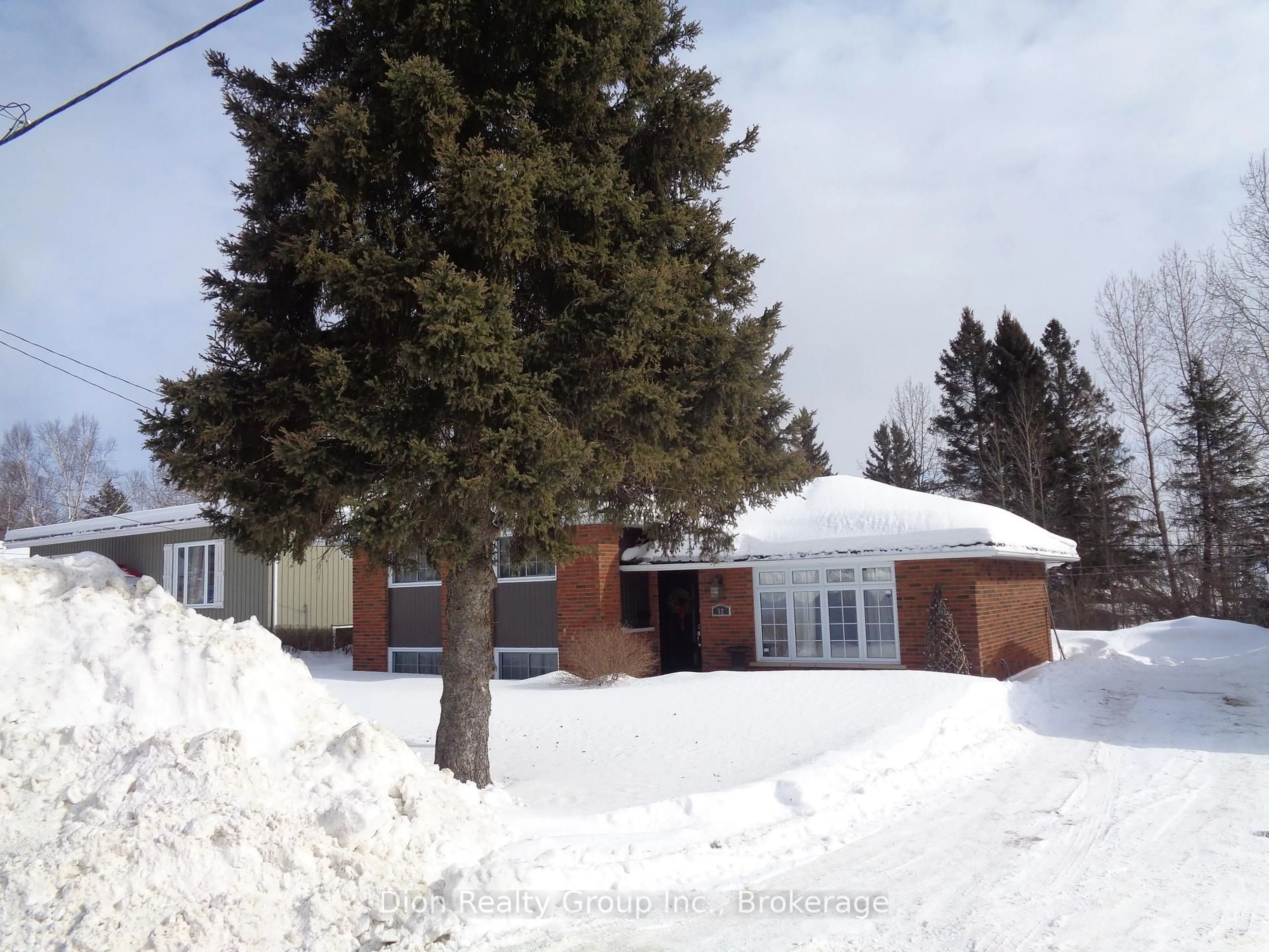 A pic from outside/outdoor area/front of a property/back of a property/a pic from drone, street for 52 Tweedsmuir Rd, Kirkland Lake Ontario P2N 1N9