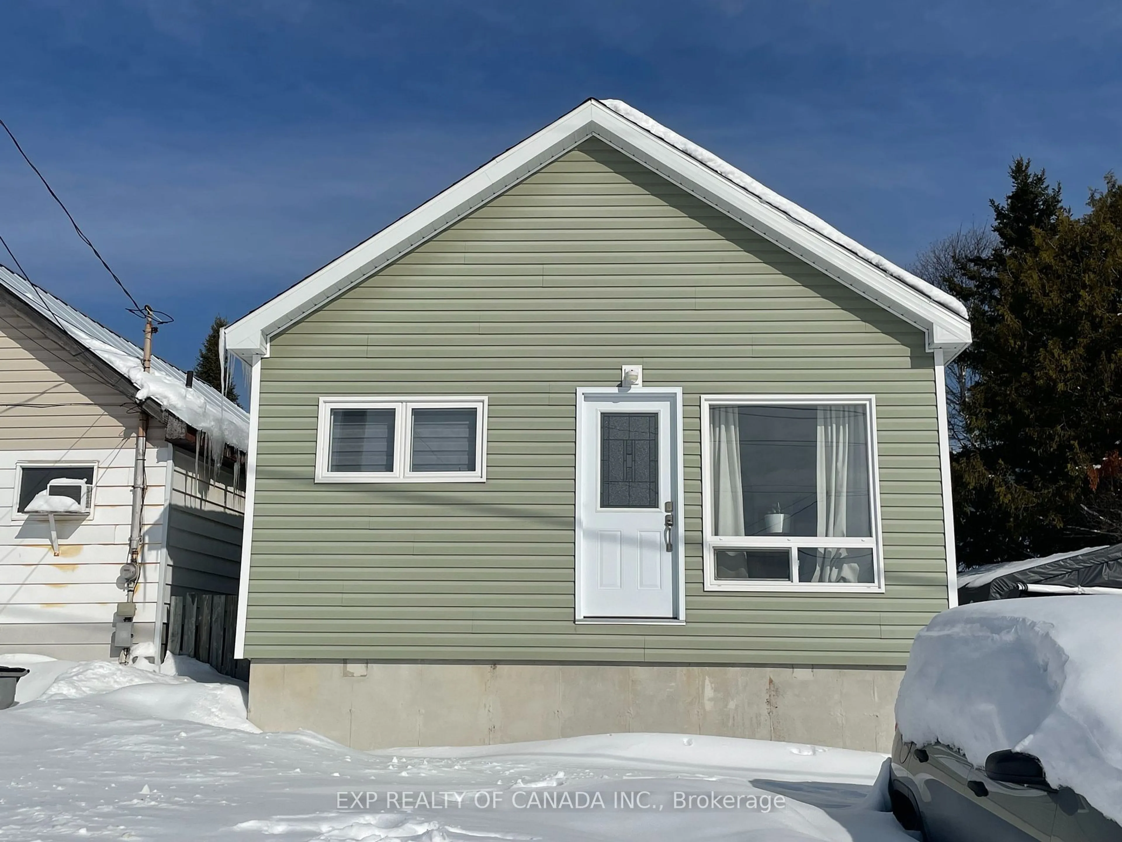 Home with vinyl exterior material, street for 60 Strachan Ave, Timmins Ontario P0N 1H0