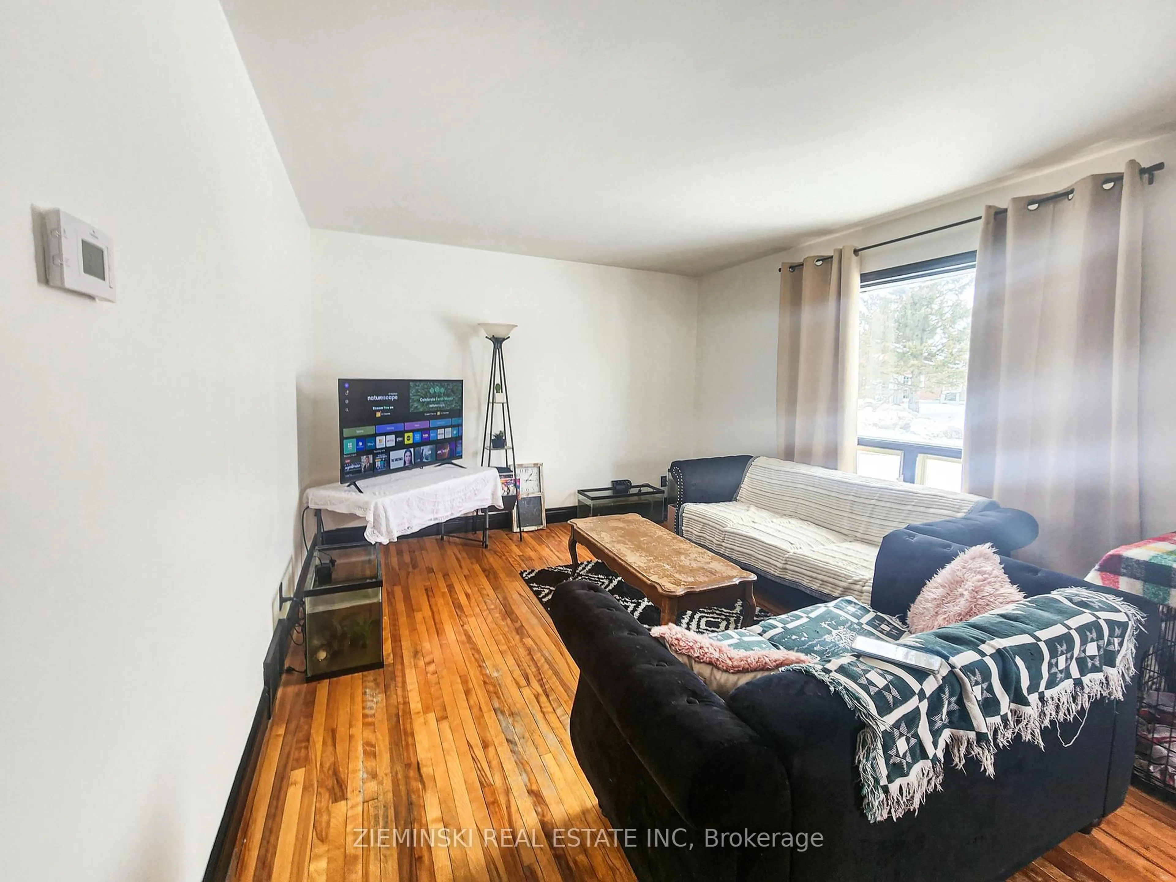 Living room with furniture, wood/laminate floor for 1 Bowman Ave, Black River Matheson Ontario P0K 1N0