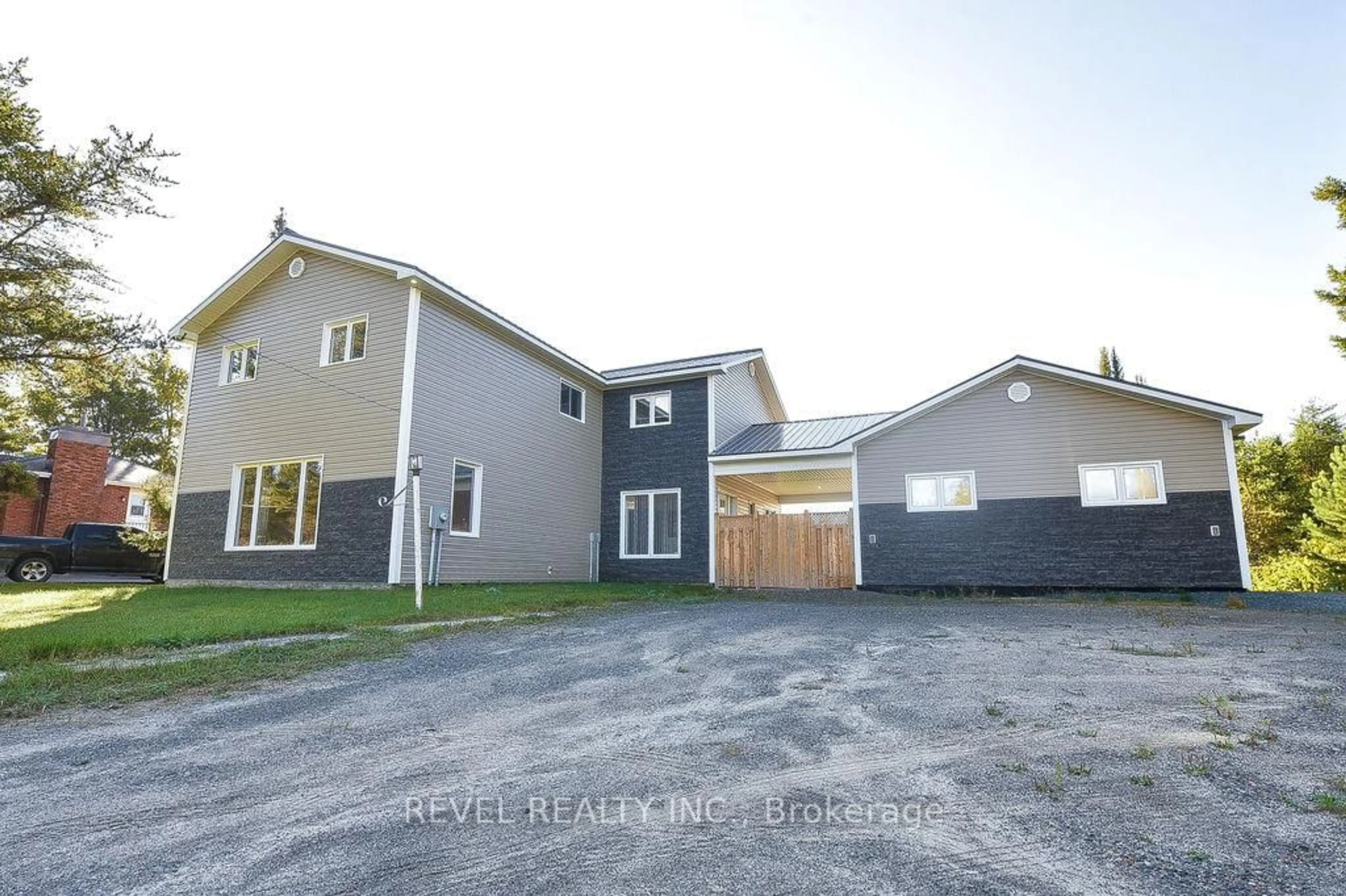 A pic from outside/outdoor area/front of a property/back of a property/a pic from drone, street for 1221 Dalton Rd, Timmins Ontario P4N 7C2
