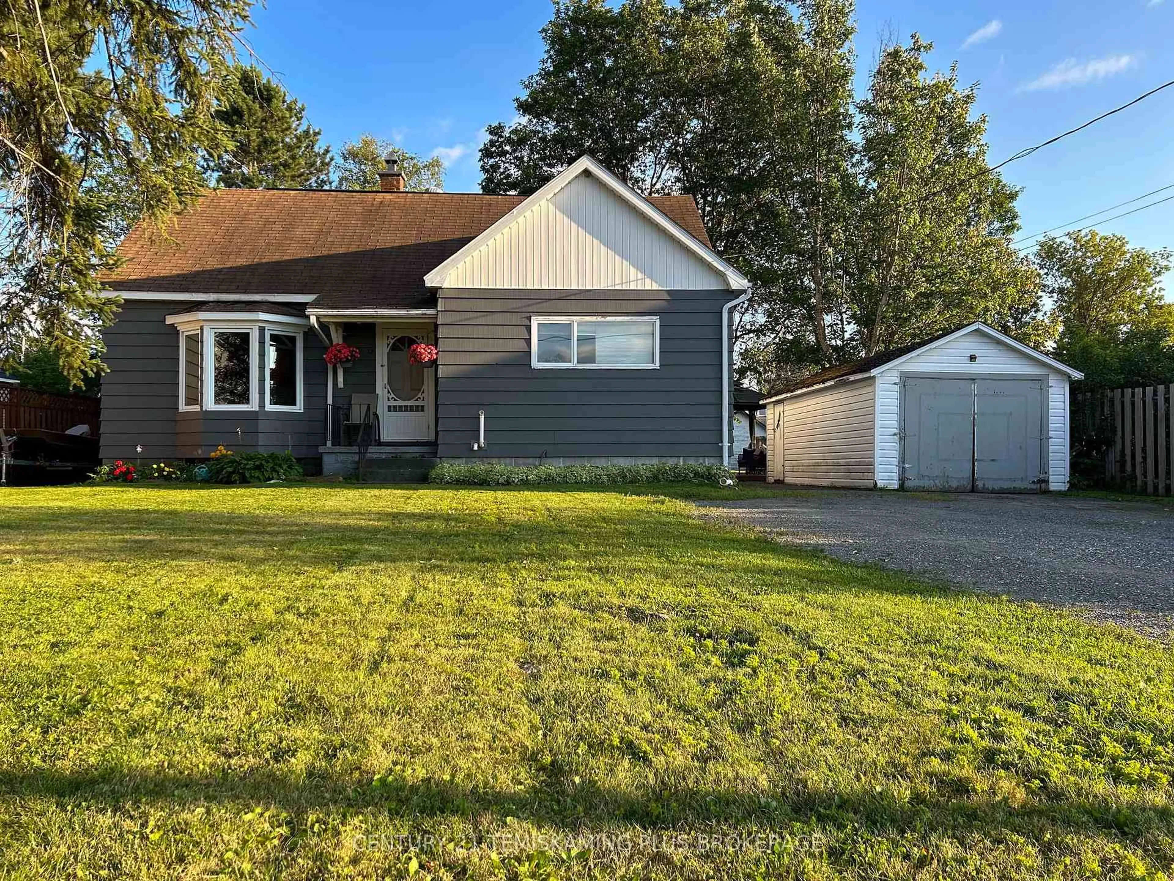 Home with vinyl exterior material, street for 12 Sixth Ave, Englehart Ontario P0J 1H0