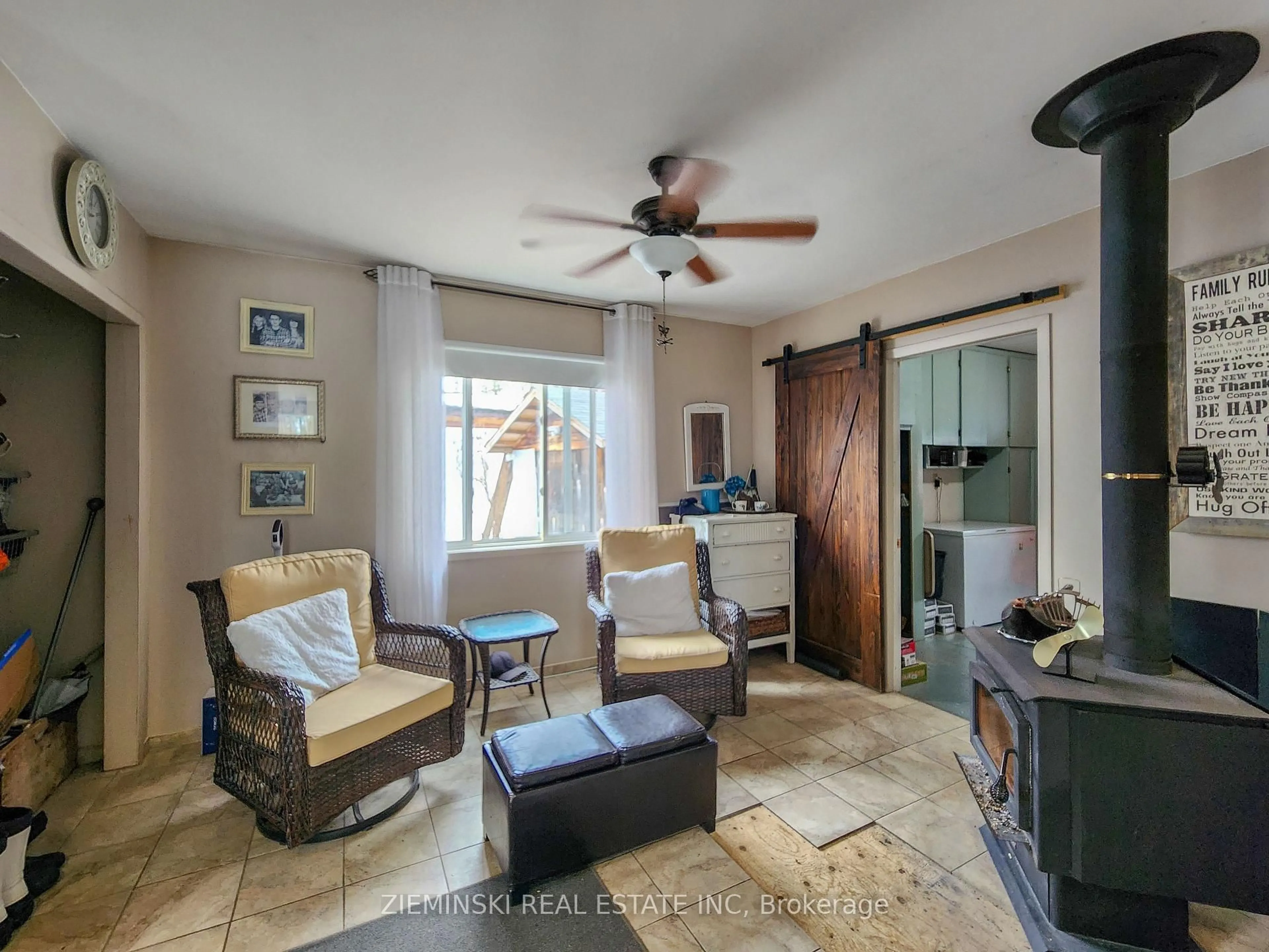 Living room with furniture, ceramic/tile floor for 8885 11 Highway #21, Iroquois Falls Ontario P0K 1G0