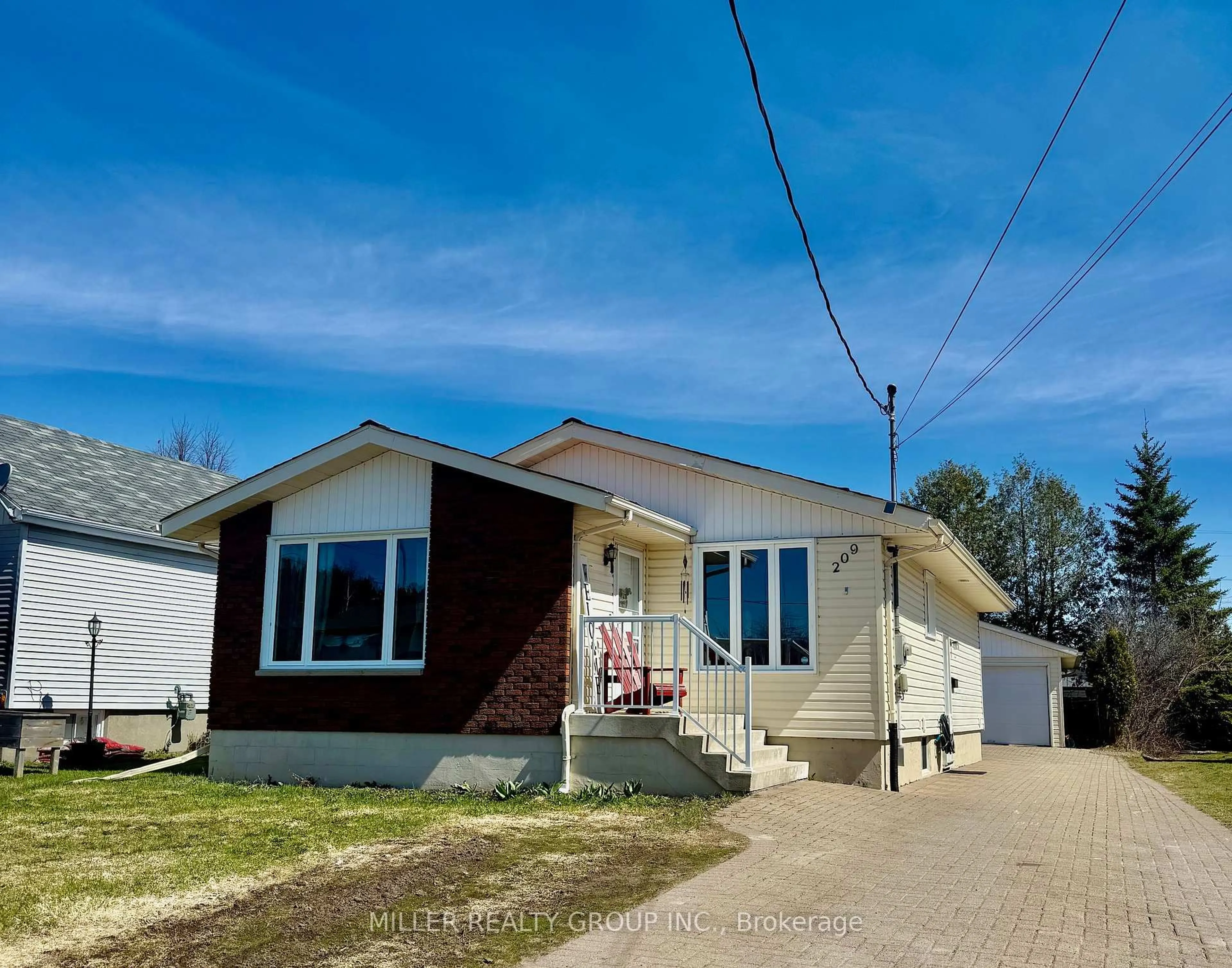 Home with vinyl exterior material, street for 209 Pine St, Temiskaming Shores Ontario P0J 1P0