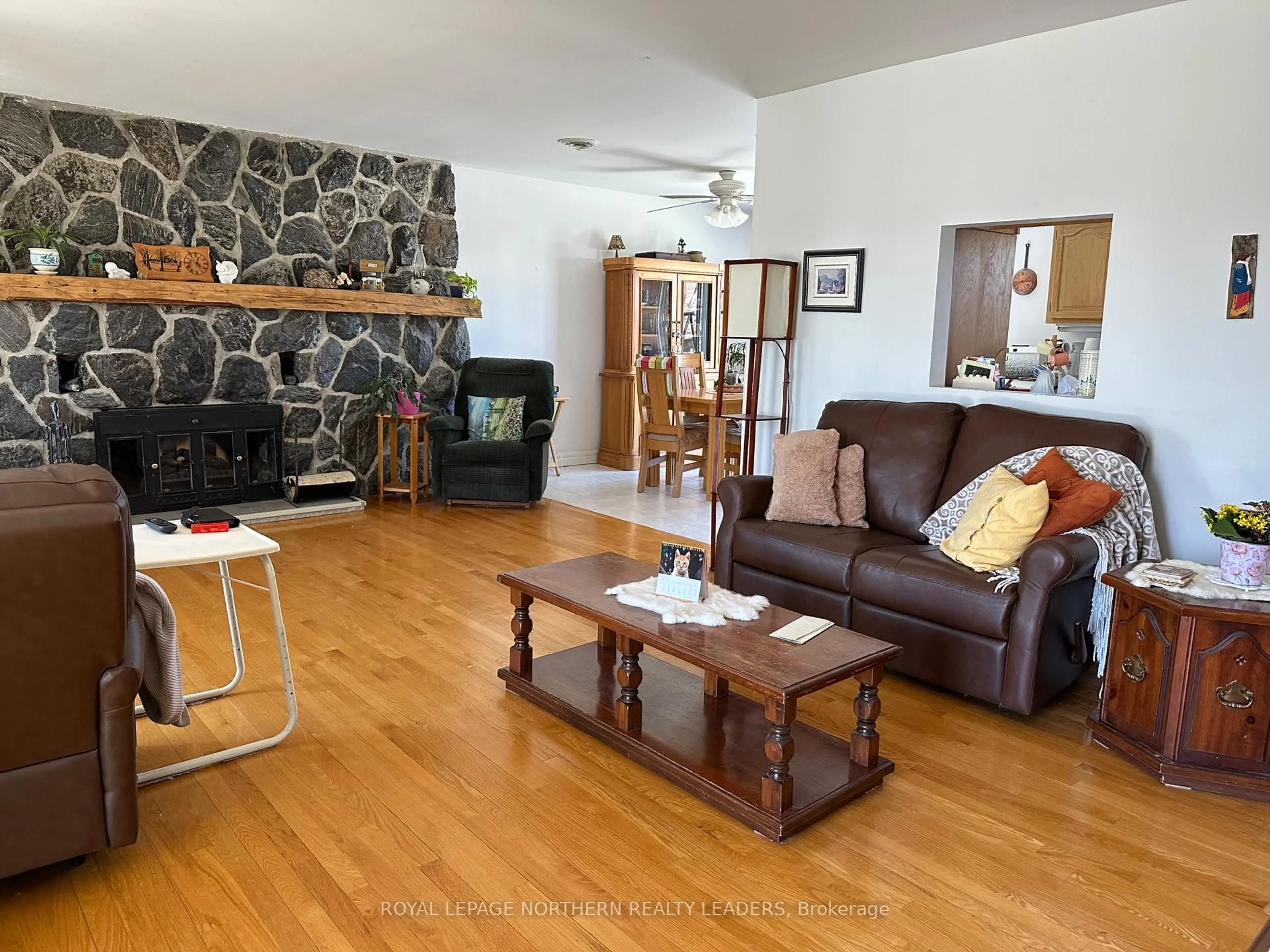 Living room with furniture, wood/laminate floor for 135 Marcel Ave, Timmins Ontario P4R 1H1