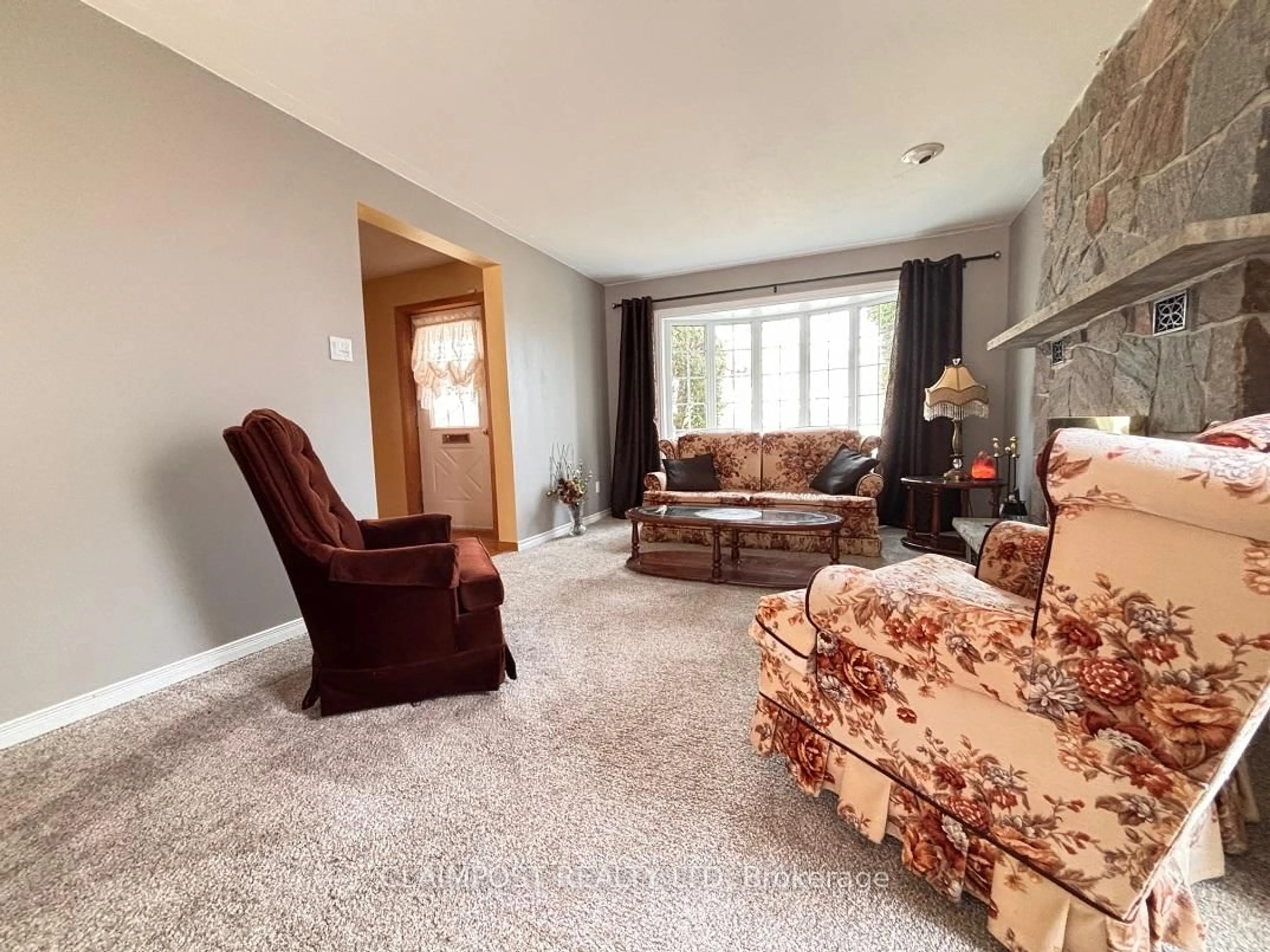 Living room with furniture, carpet floor for 990 Lalonde St, Timmins Ontario P4B 1B8