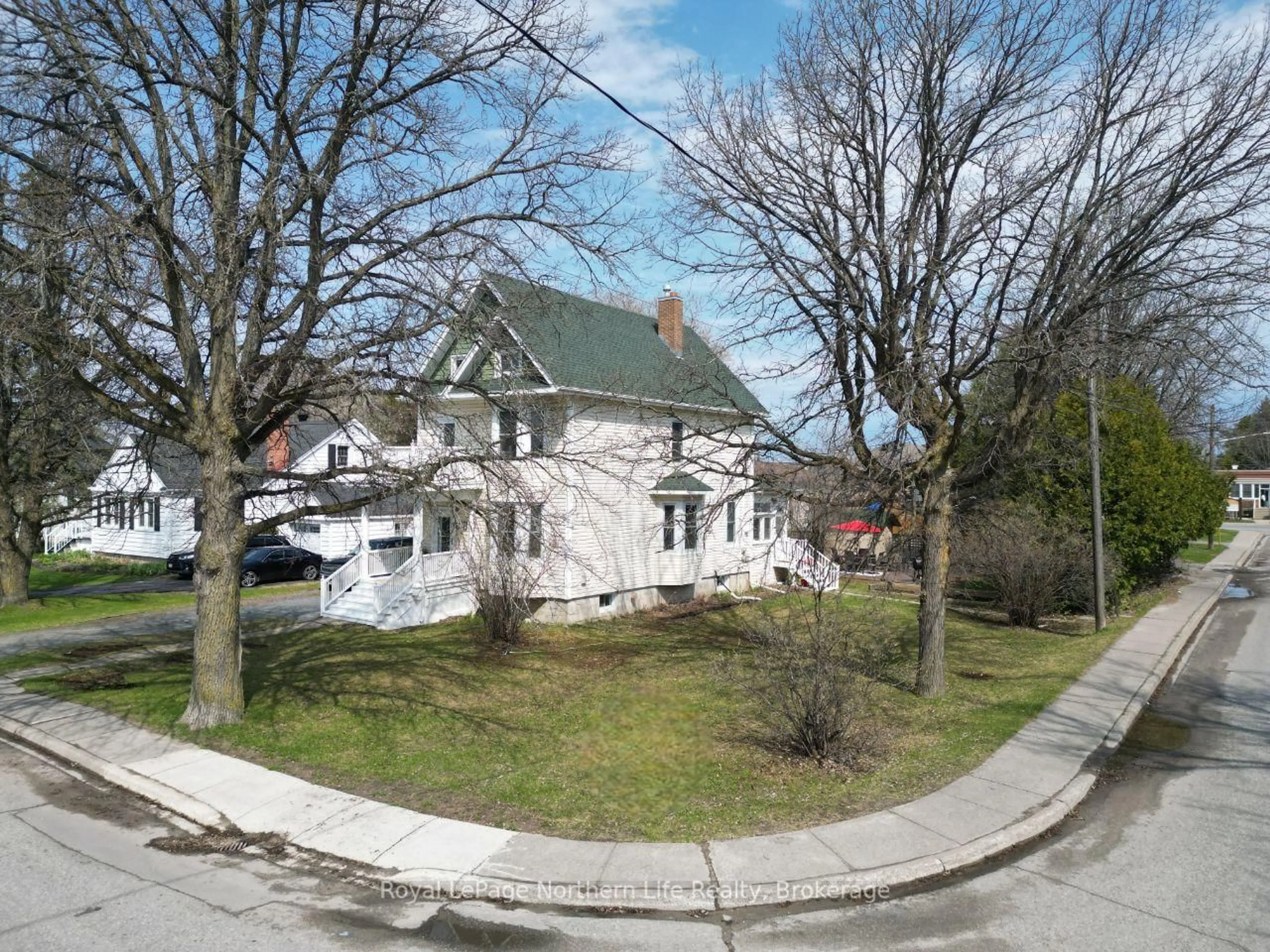 A pic from outside/outdoor area/front of a property/back of a property/a pic from drone, street for 211 Farah Ave, Temiskaming Shores Ontario P0J 1P0