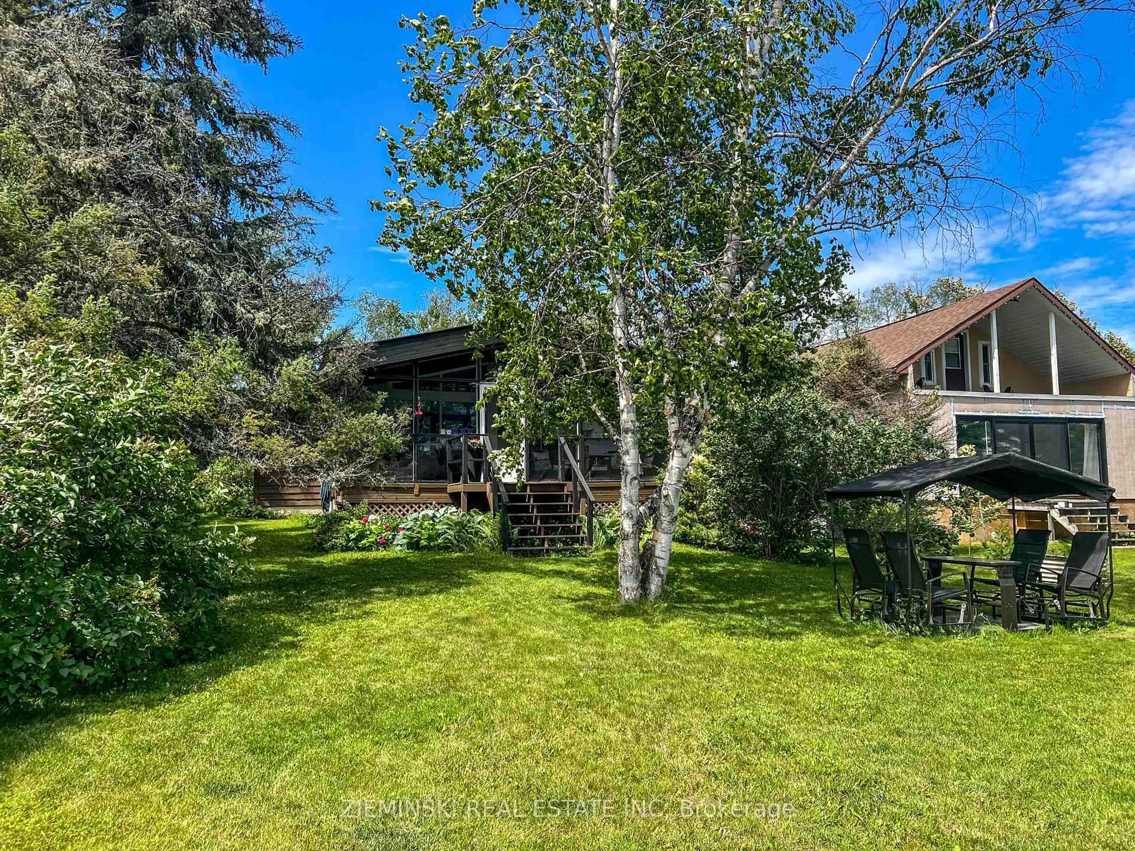 A pic from outside/outdoor area/front of a property/back of a property/a pic from drone, forest/trees view for 311 Leclair Ave, Timmins Ontario P4R 0C1