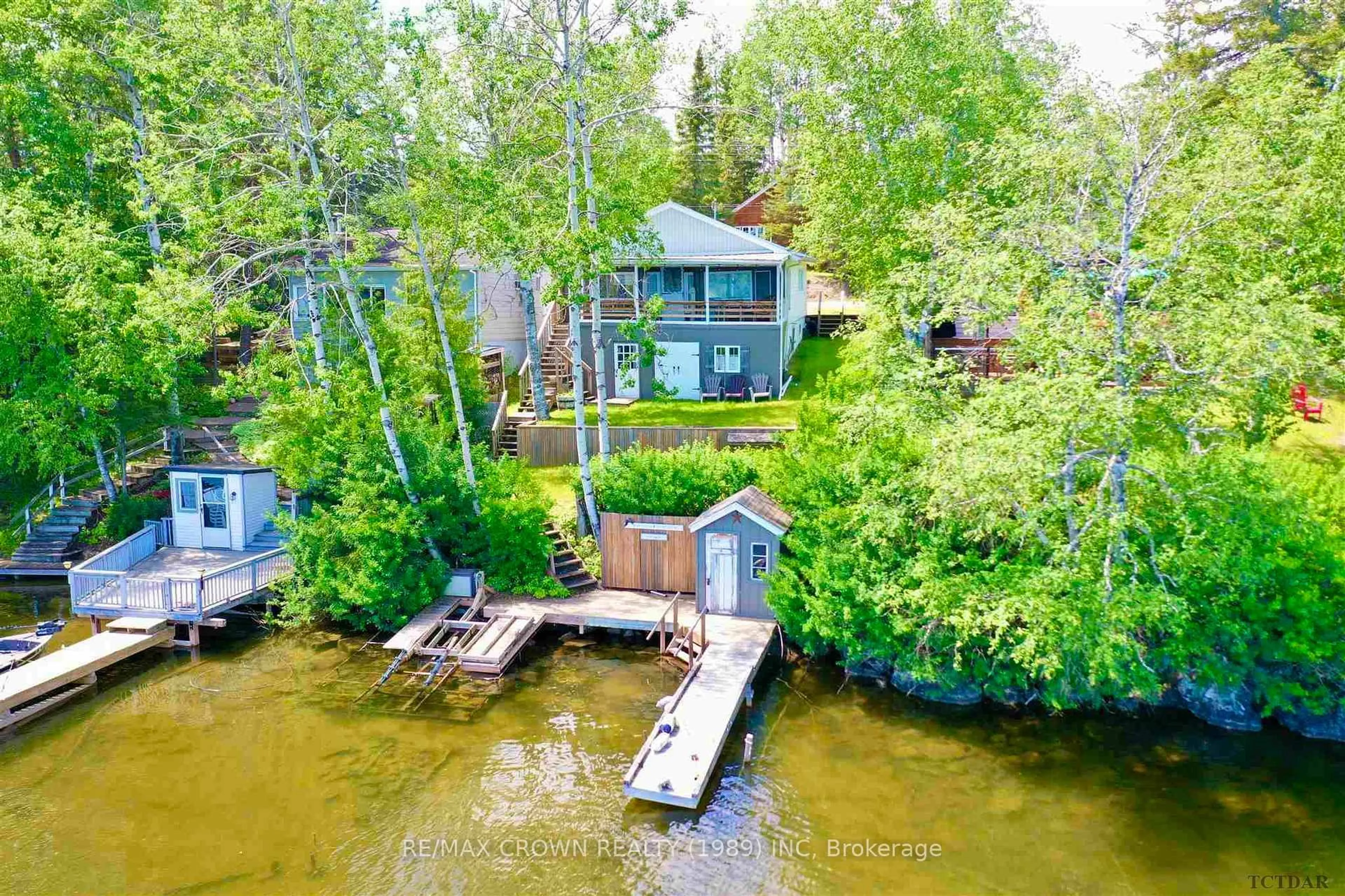 A pic from outside/outdoor area/front of a property/back of a property/a pic from drone, water/lake/river/ocean view for 10 Paterson Rd, Moonbeam Ontario P0L 1V0