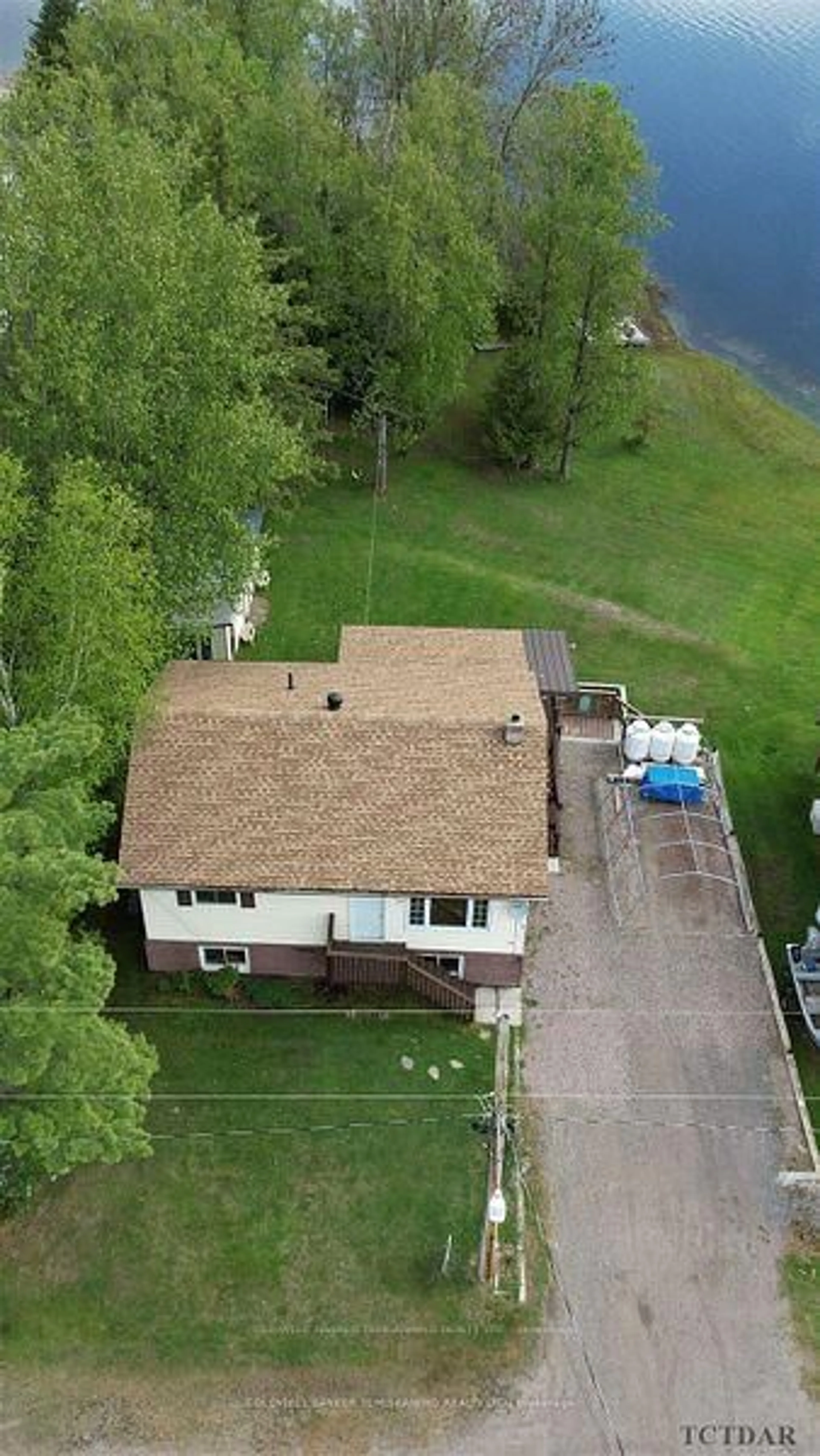 A pic from outside/outdoor area/front of a property/back of a property/a pic from drone, water/lake/river/ocean view for 39 THIRD St, James Ontario P0J 1G0
