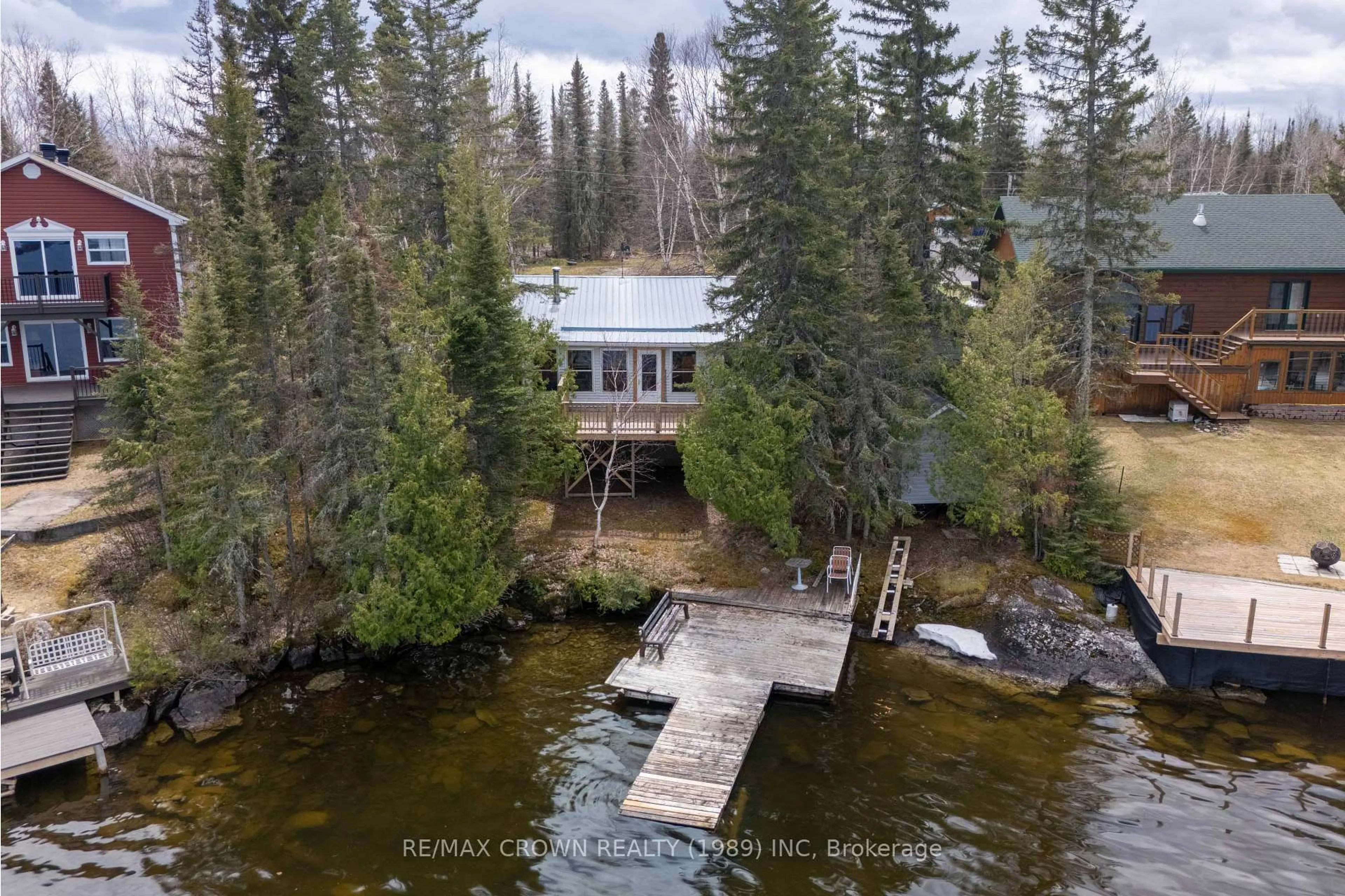 A pic from outside/outdoor area/front of a property/back of a property/a pic from drone, water/lake/river/ocean view for 55 Sailing Club Rd, Moonbeam Ontario P0L 1V0