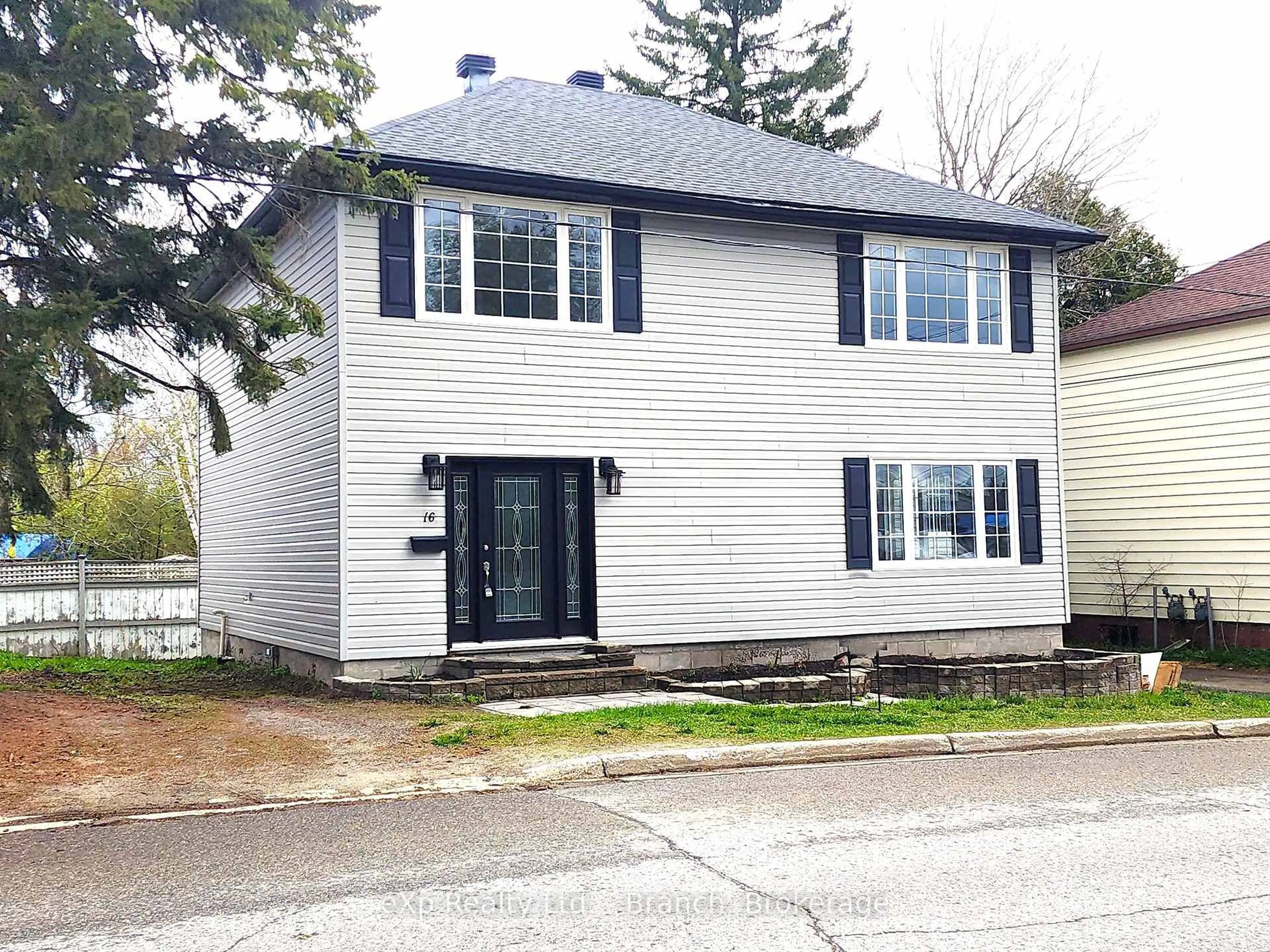 Home with vinyl exterior material, street for 16 Allen Ave, Kirkland Lake Ontario P2N 2B8