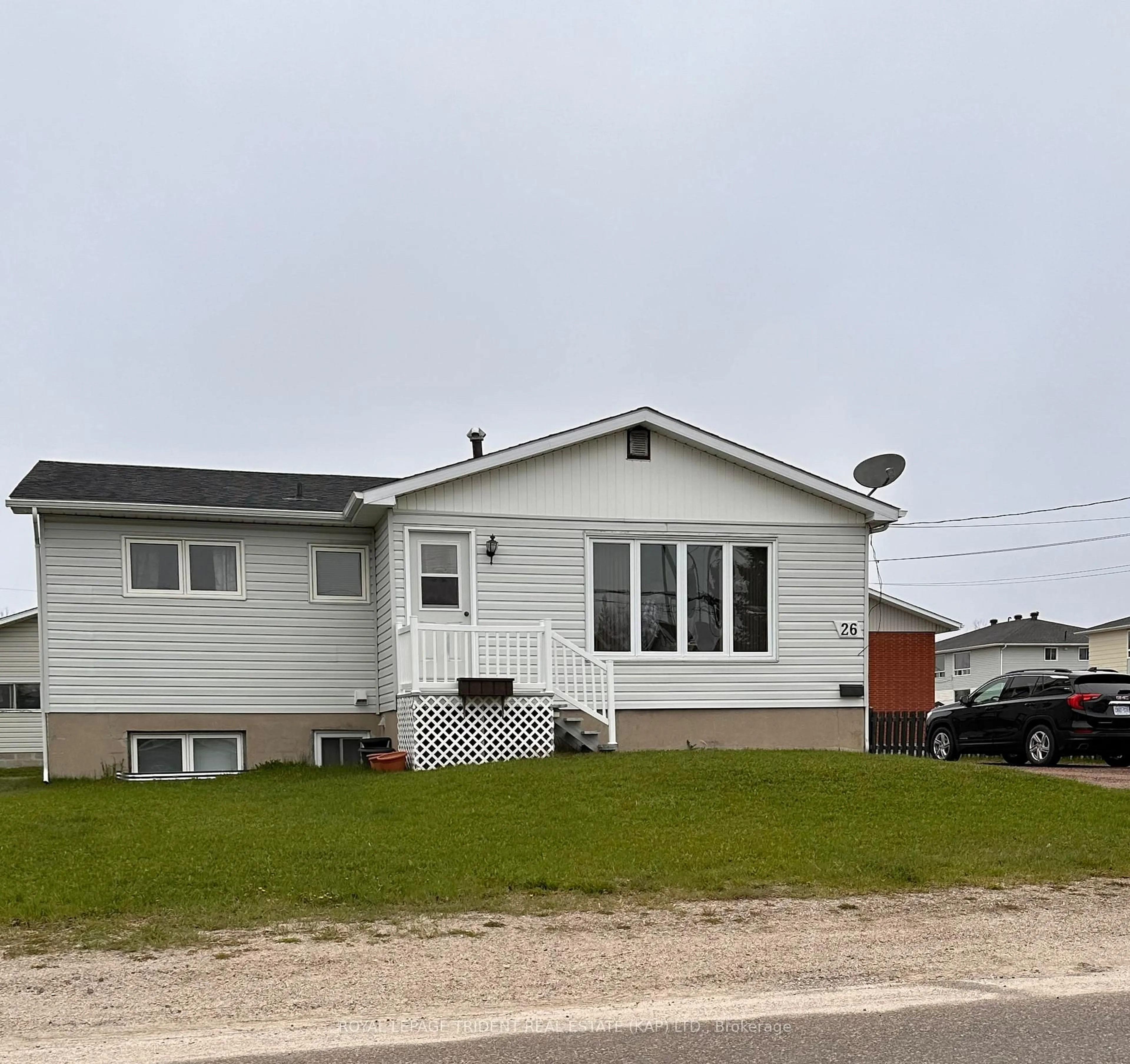Home with vinyl exterior material, street for 26 St. Patrick St, Kapuskasing Ontario P5N 2S1