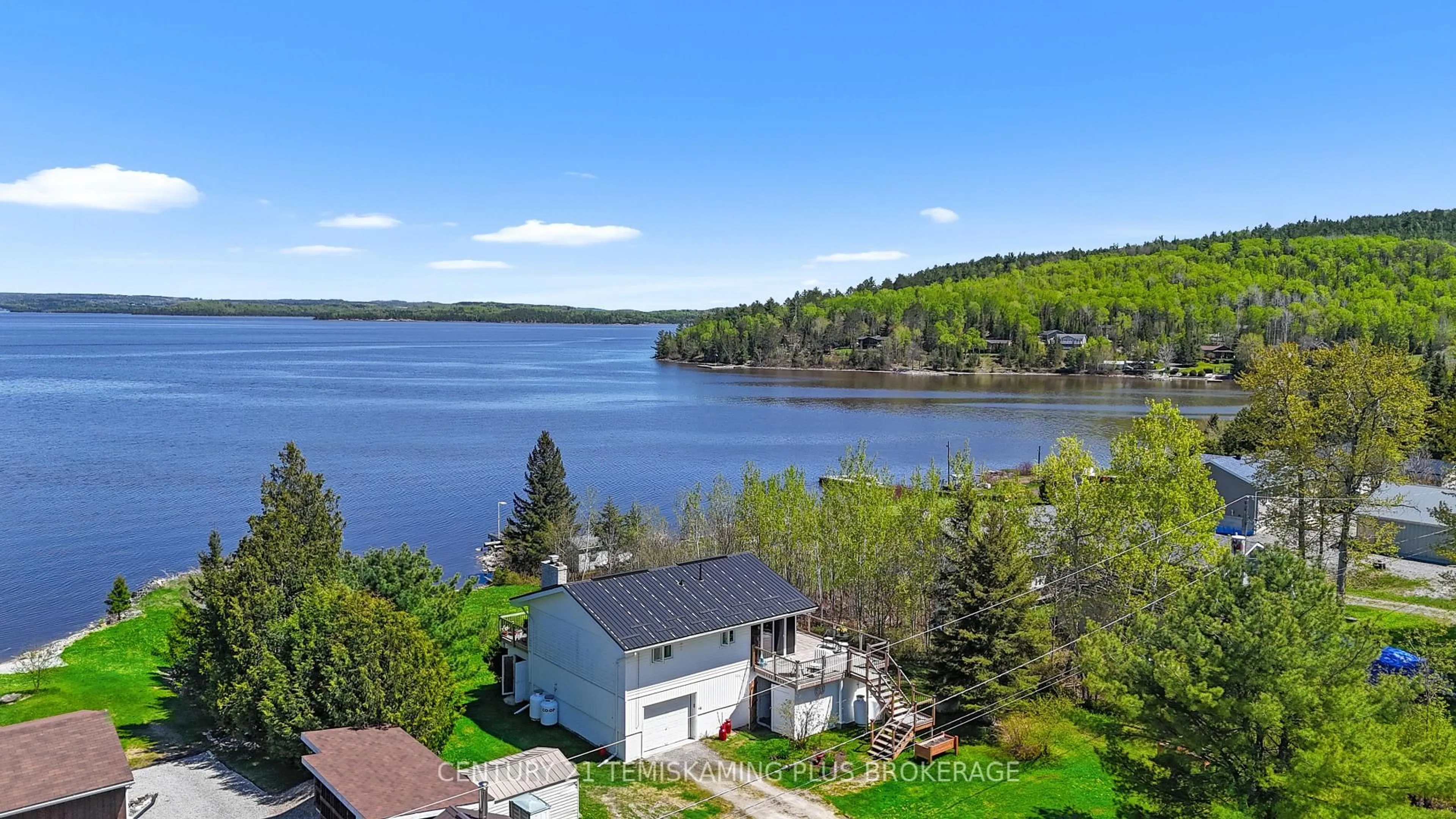 A pic from outside/outdoor area/front of a property/back of a property/a pic from drone, water/lake/river/ocean view for 501178 Berry Rd, Timiskaming Ontario P0J 1P0
