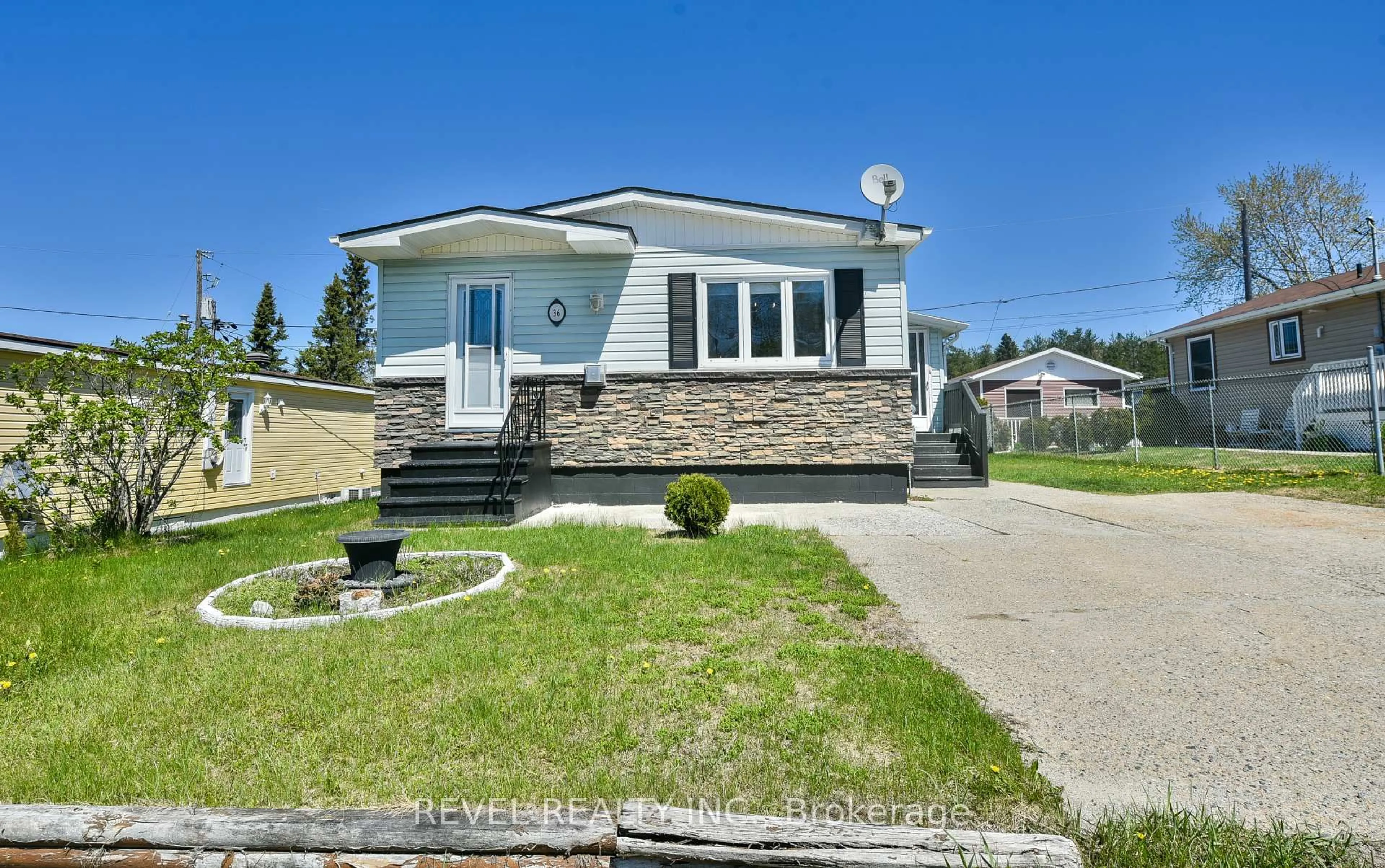 Home with vinyl exterior material, street for 36 Foothills Lane, Timmins Ontario P4N 8R9