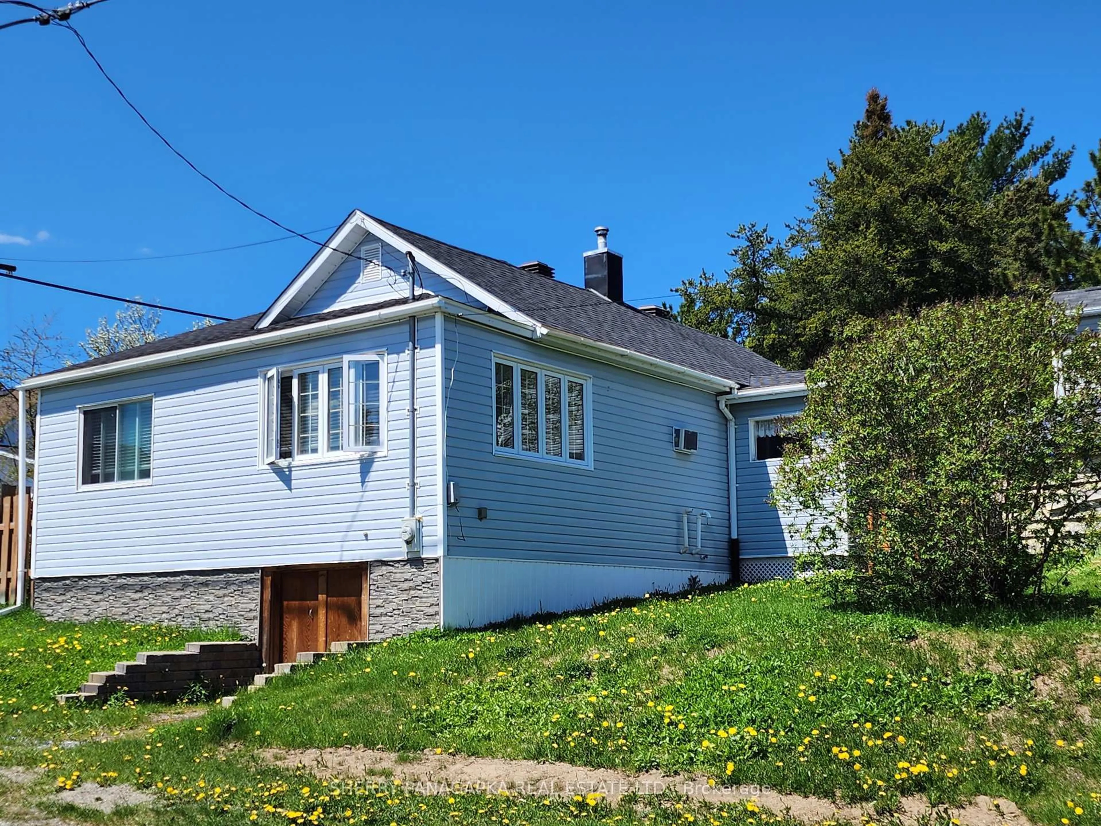 Home with vinyl exterior material, street for 12 Brookbank Ave, Kirkland Lake Ontario P2N 1V5