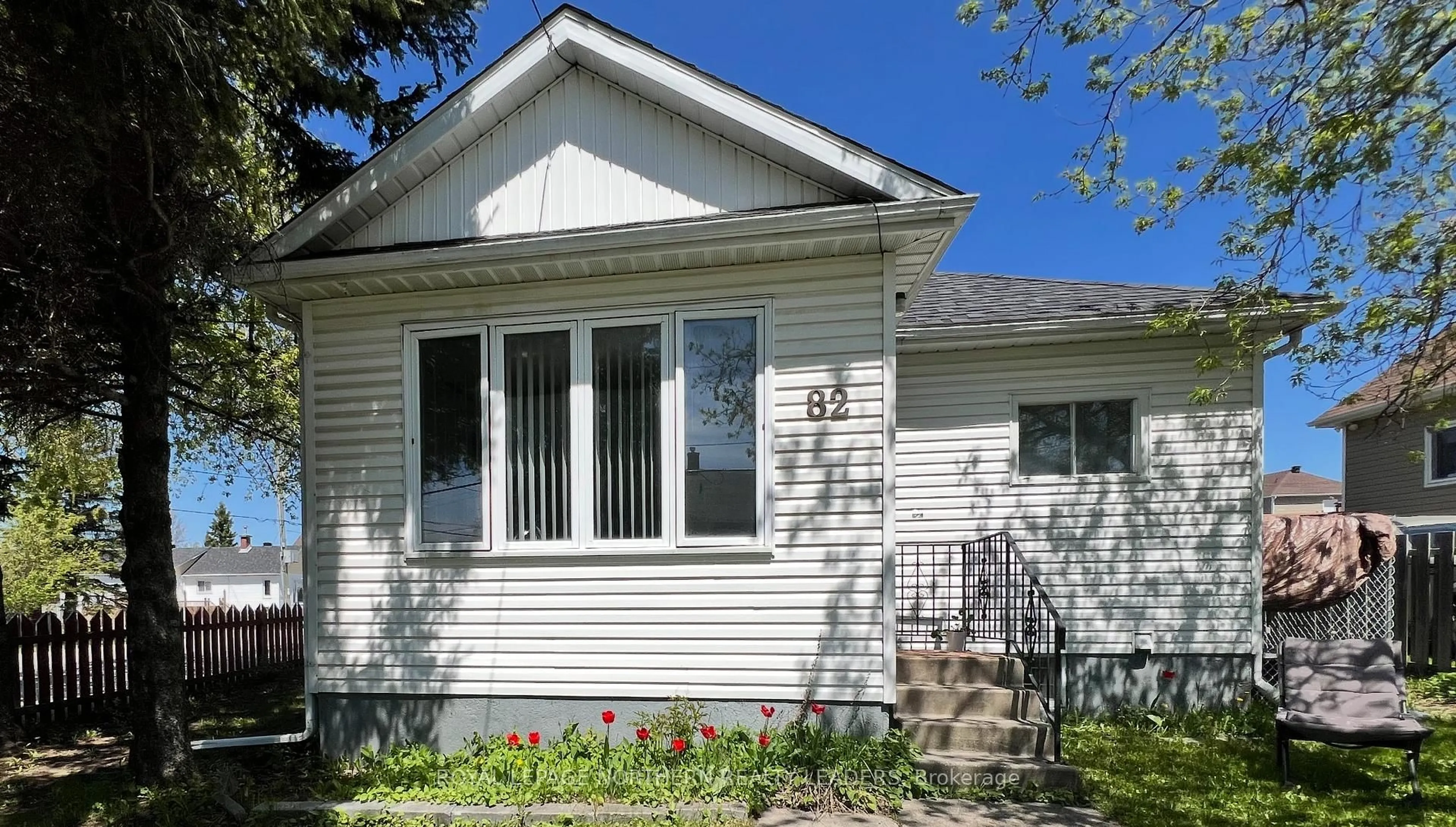 Home with vinyl exterior material, street for 82 Floral Ave, Timmins Ontario P4N 4H5
