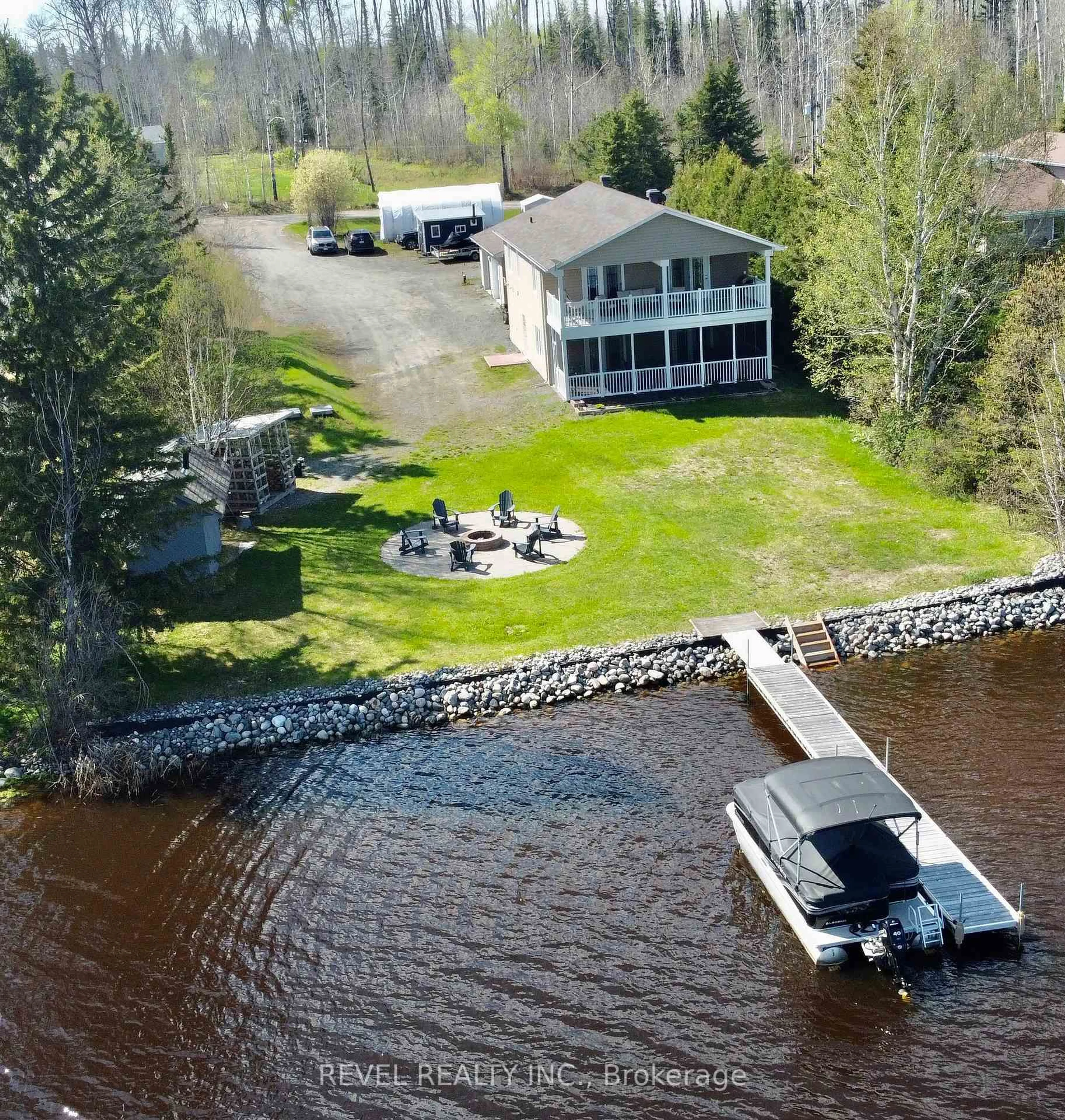 A pic from outside/outdoor area/front of a property/back of a property/a pic from drone, water/lake/river/ocean view for 793 Leclair Ave, Timmins Ontario P4N 7C3