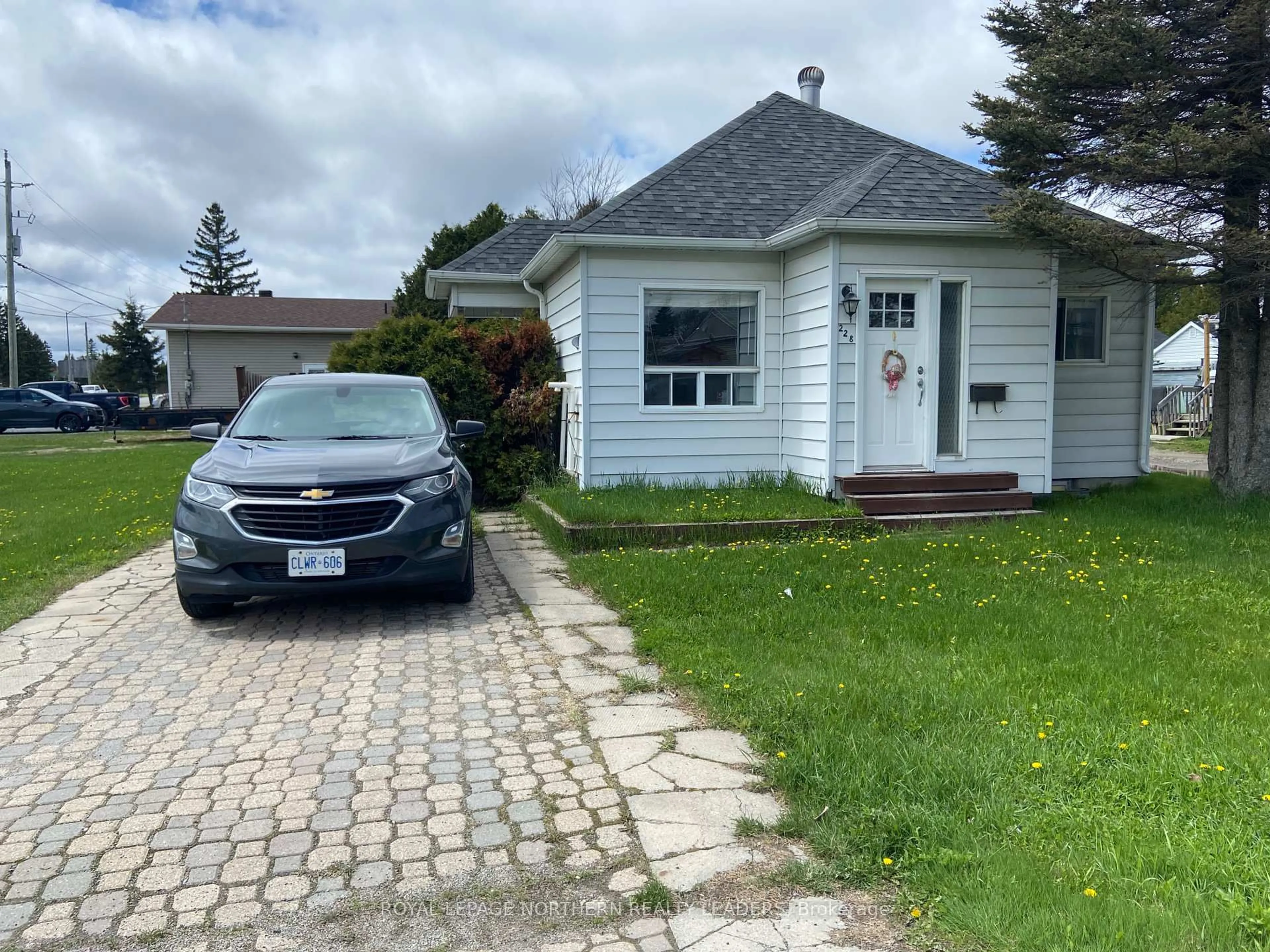 A pic from outside/outdoor area/front of a property/back of a property/a pic from drone, street for 228 Moore St, Timmins Ontario P0N 1H0