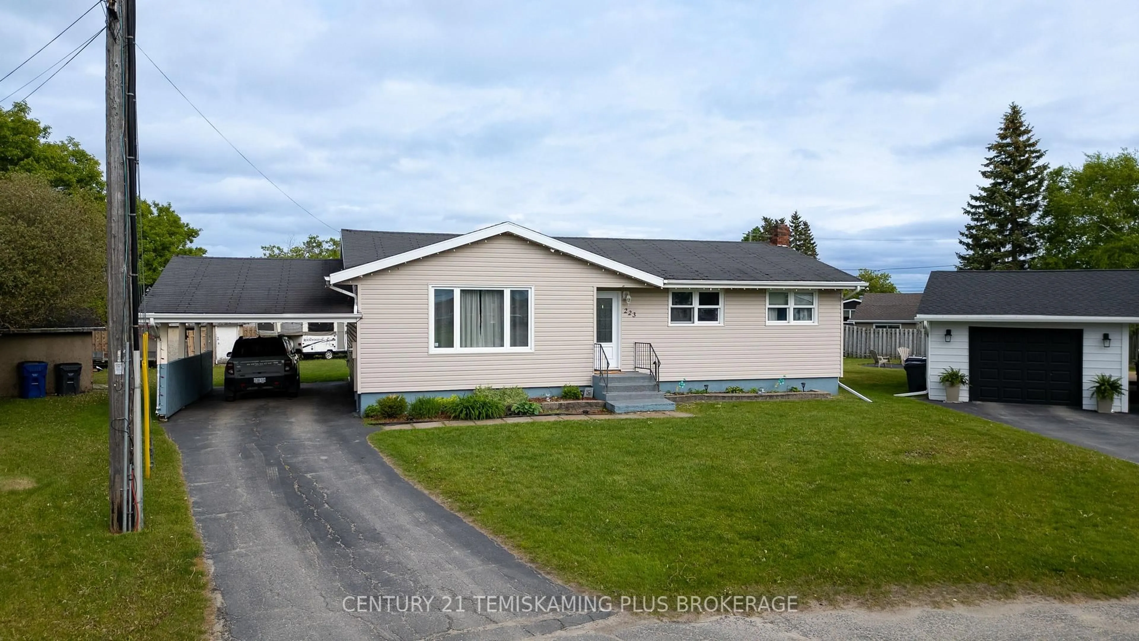 Home with vinyl exterior material, street for 223 Byam Ave, Temiskaming Shores Ontario P0J 1P0