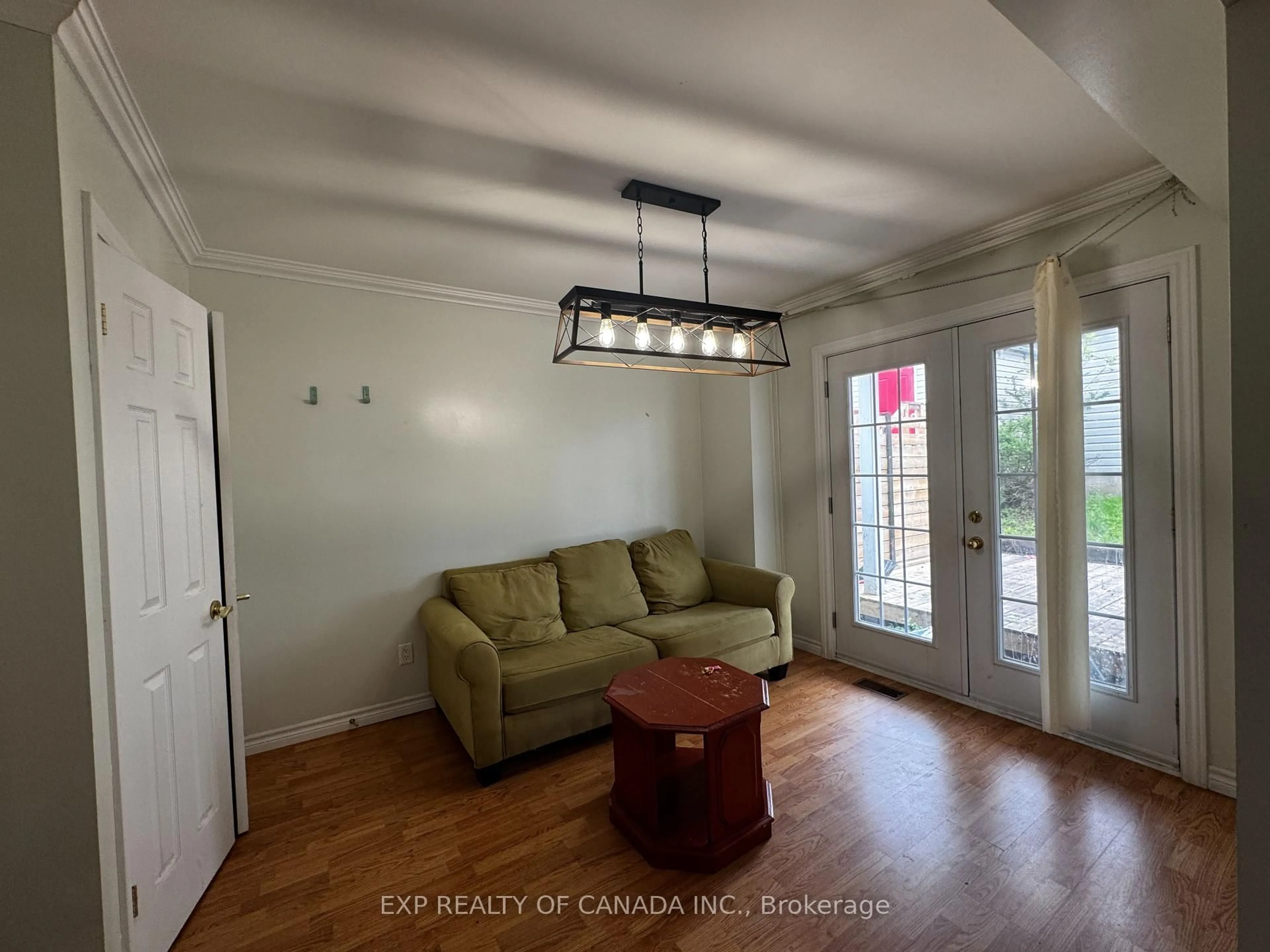 Living room with furniture, wood/laminate floor for 364 Cherry St, Timmins Ontario P4N 6W7