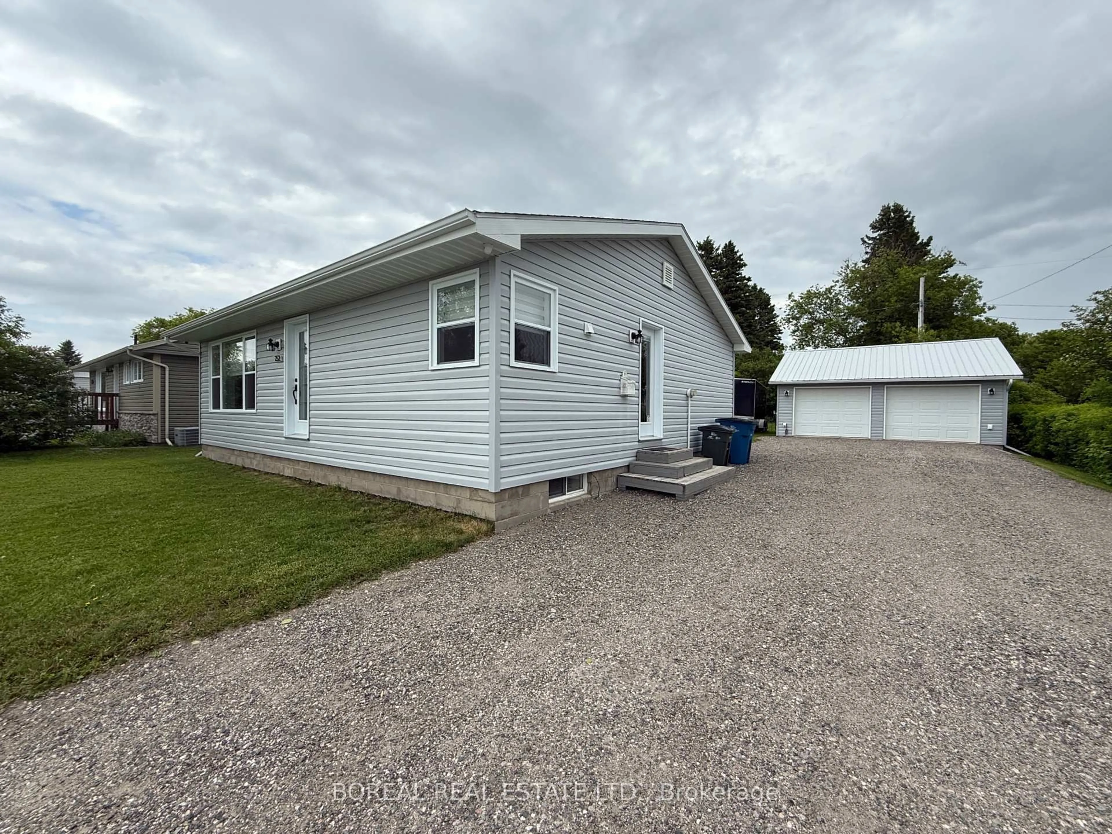 Home with vinyl exterior material, street for 252 Fourteenth Ave, Cochrane Ontario P0L 1C0