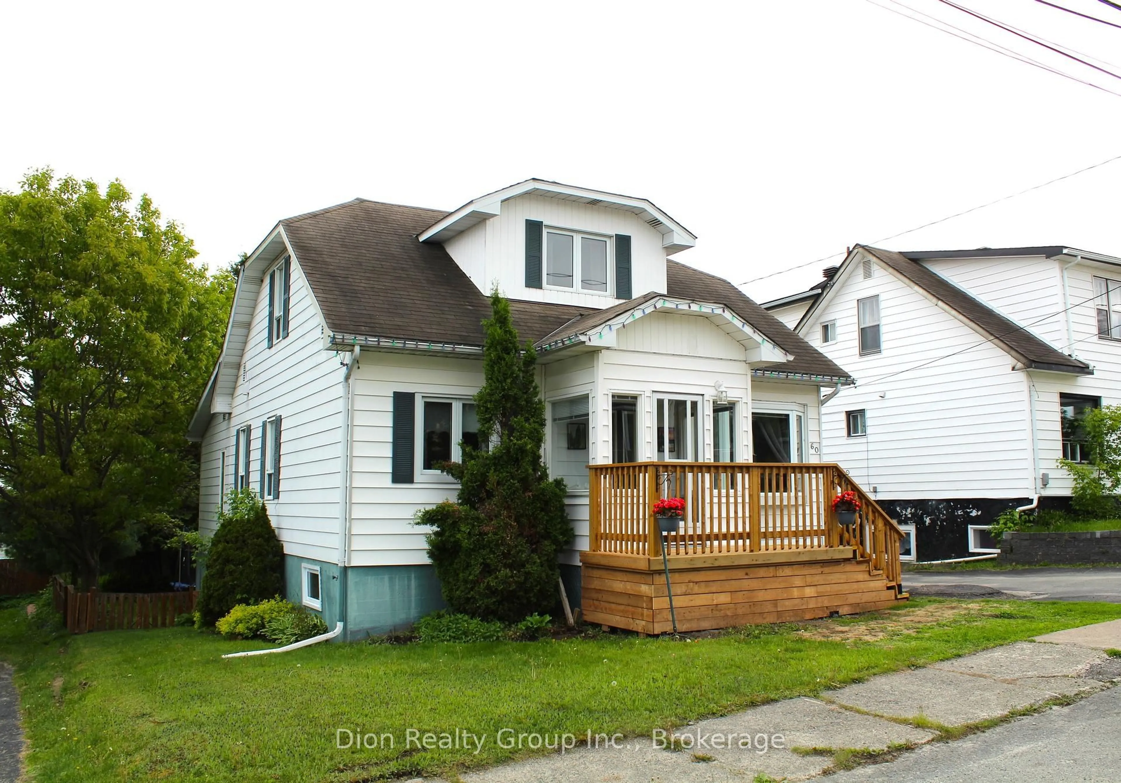 Home with vinyl exterior material, street for 60 McCamus Ave, Kirkland Lake Ontario P2N 2J7