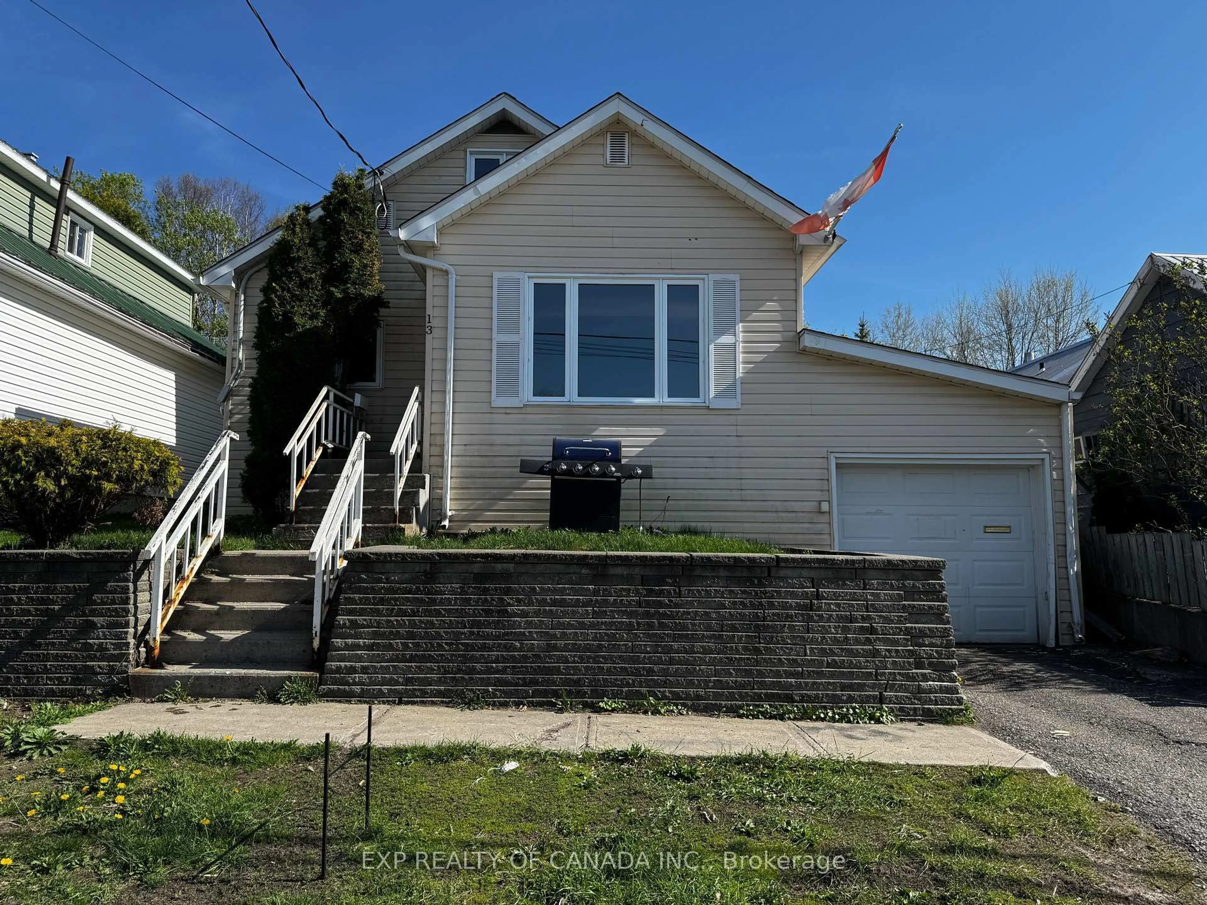Home with vinyl exterior material, street for 13 Premier Ave, Kirkland Lake Ontario P2N 2S5