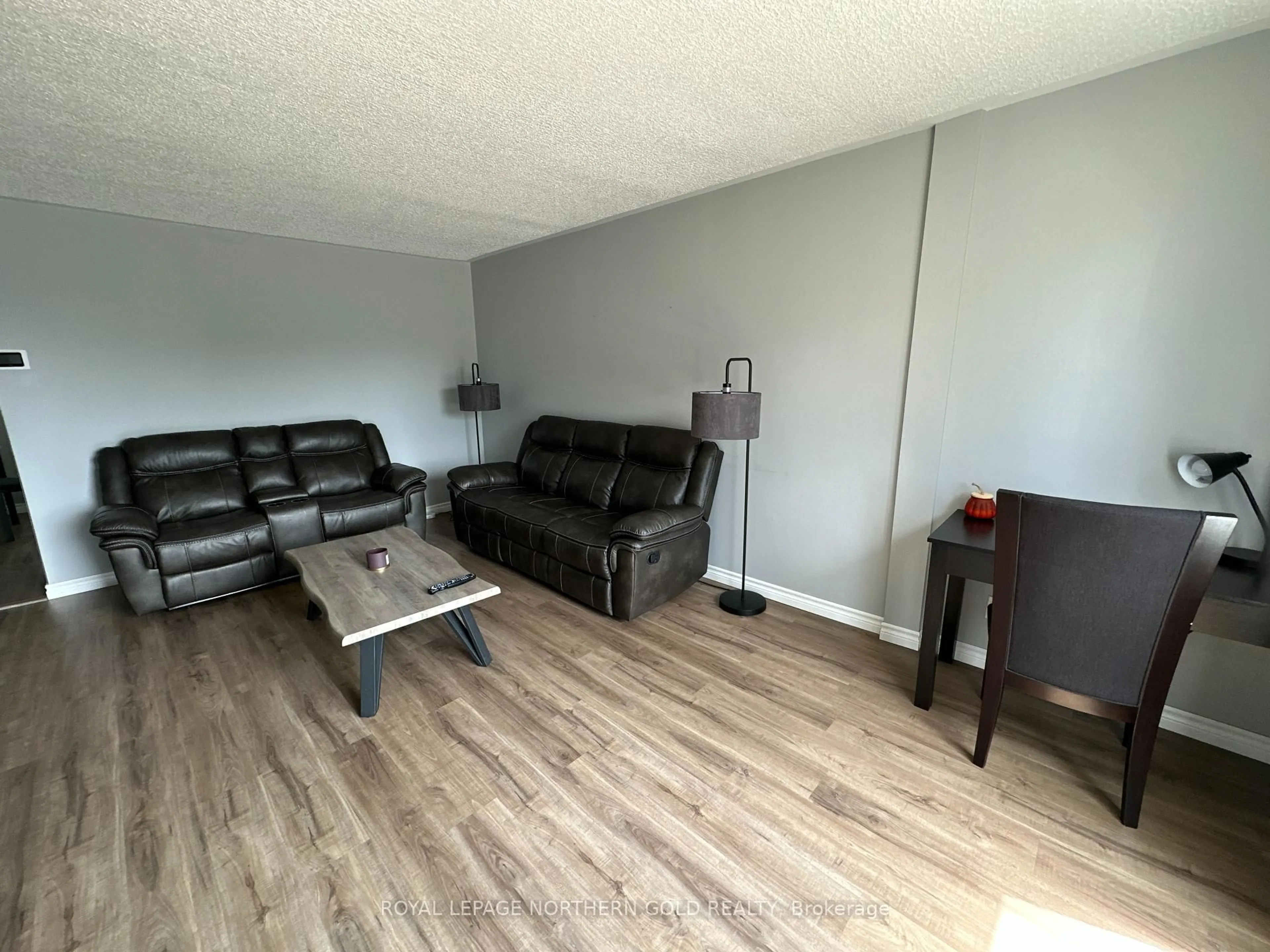 Living room with furniture, wood/laminate floor for 76 HARDING Ave, Kirkland Lake Ontario P2N 3N3