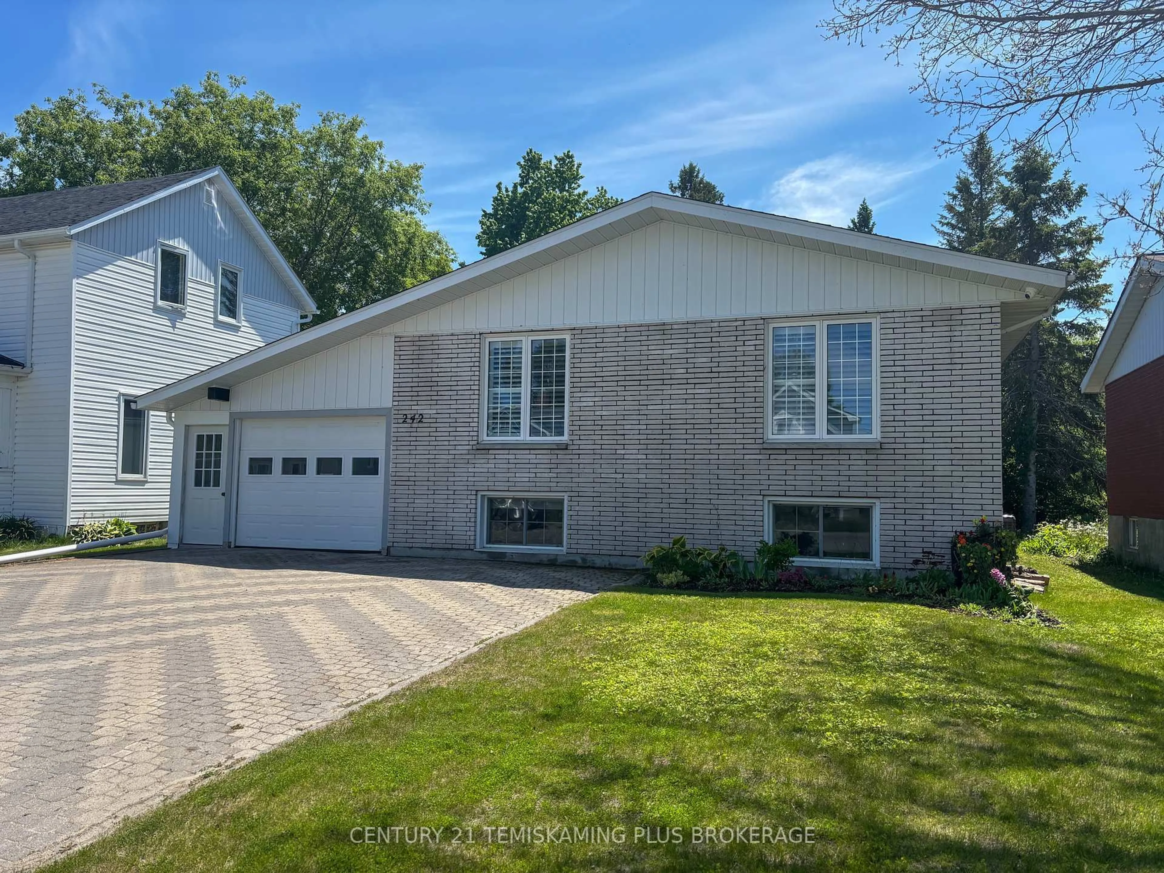 Home with vinyl exterior material, street for 242 Farah Ave, Temiskaming Shores Ontario P0J 1P0