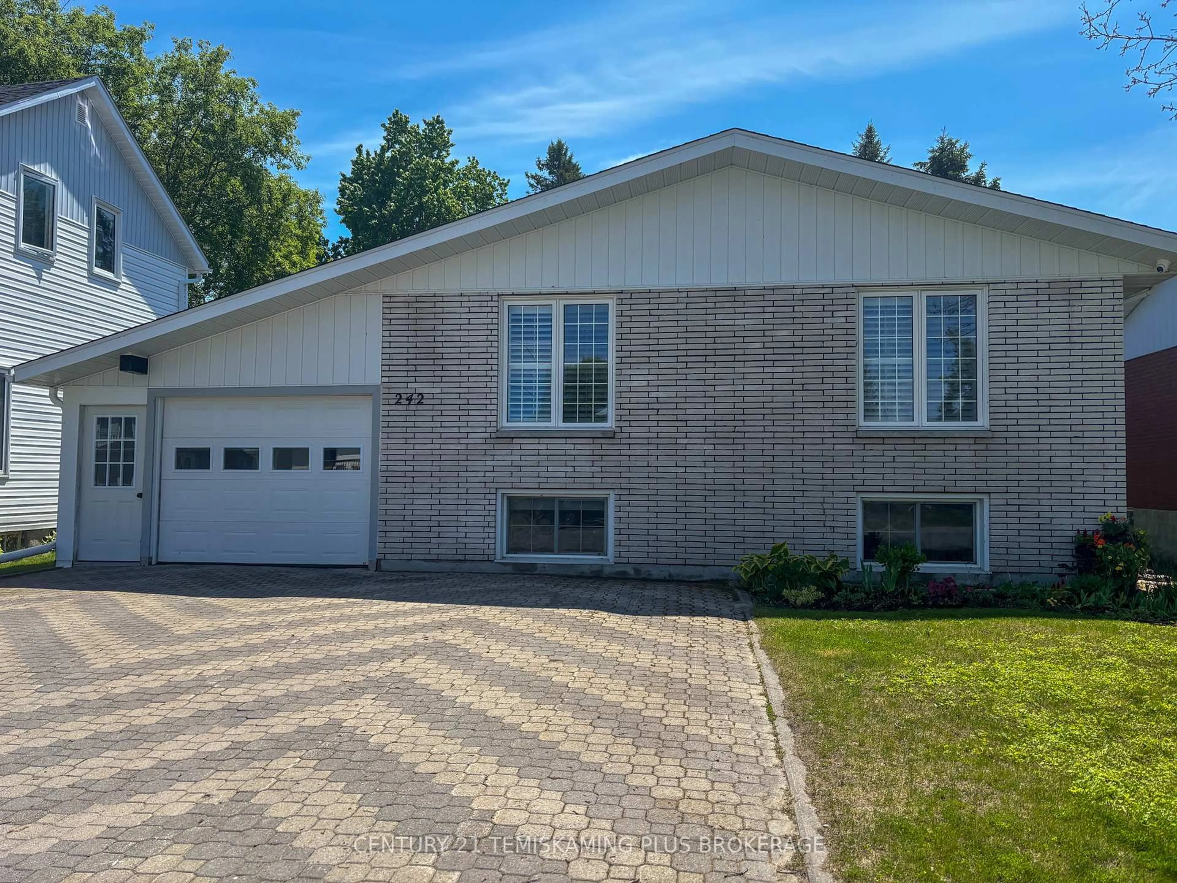 Home with vinyl exterior material, street for 242 Farah Ave, Temiskaming Shores Ontario P0J 1P0