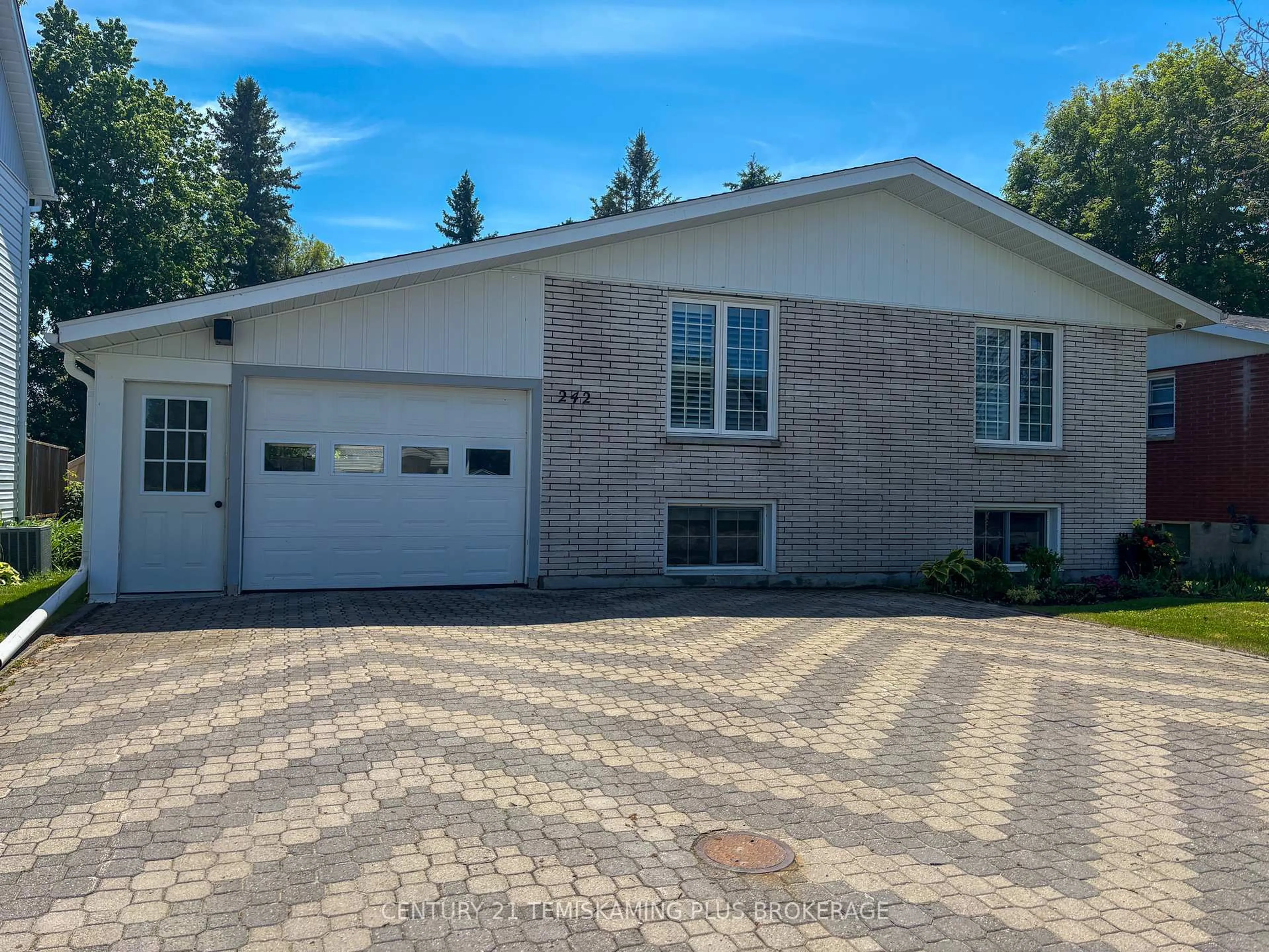 Home with brick exterior material, street for 242 Farah Ave, Temiskaming Shores Ontario P0J 1P0