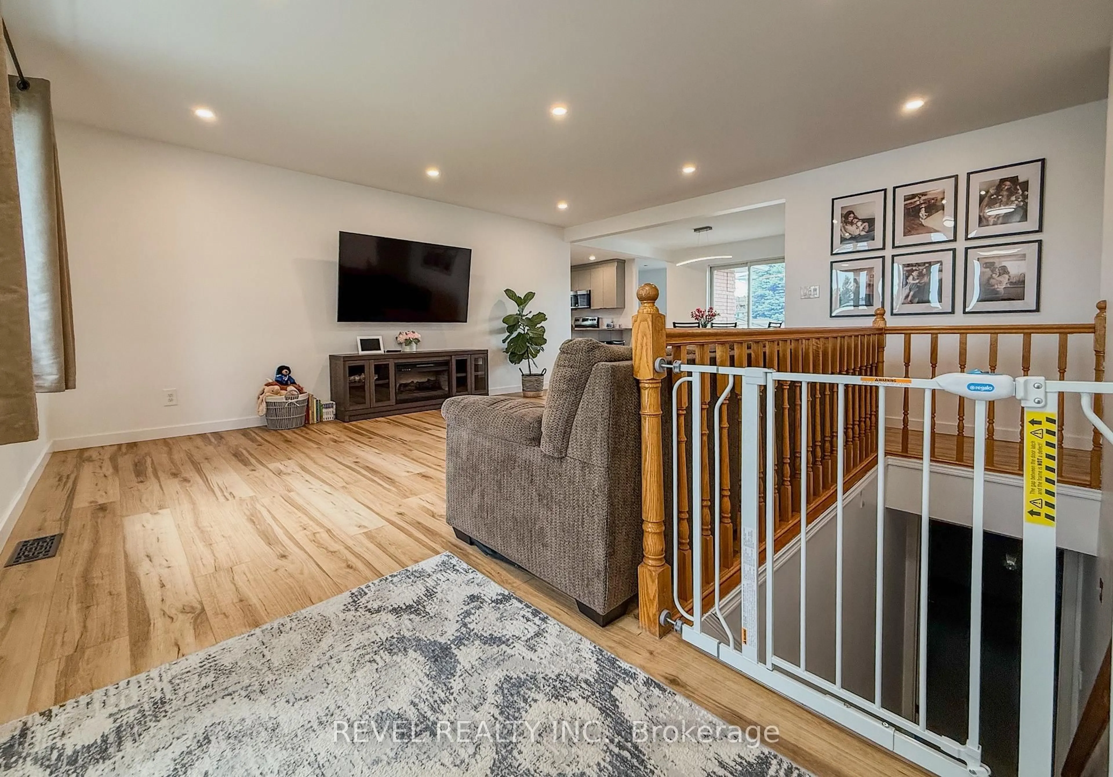 Living room with furniture, wood/laminate floor for 222 Laurentian Cres, Timmins Ontario P4R 1J9
