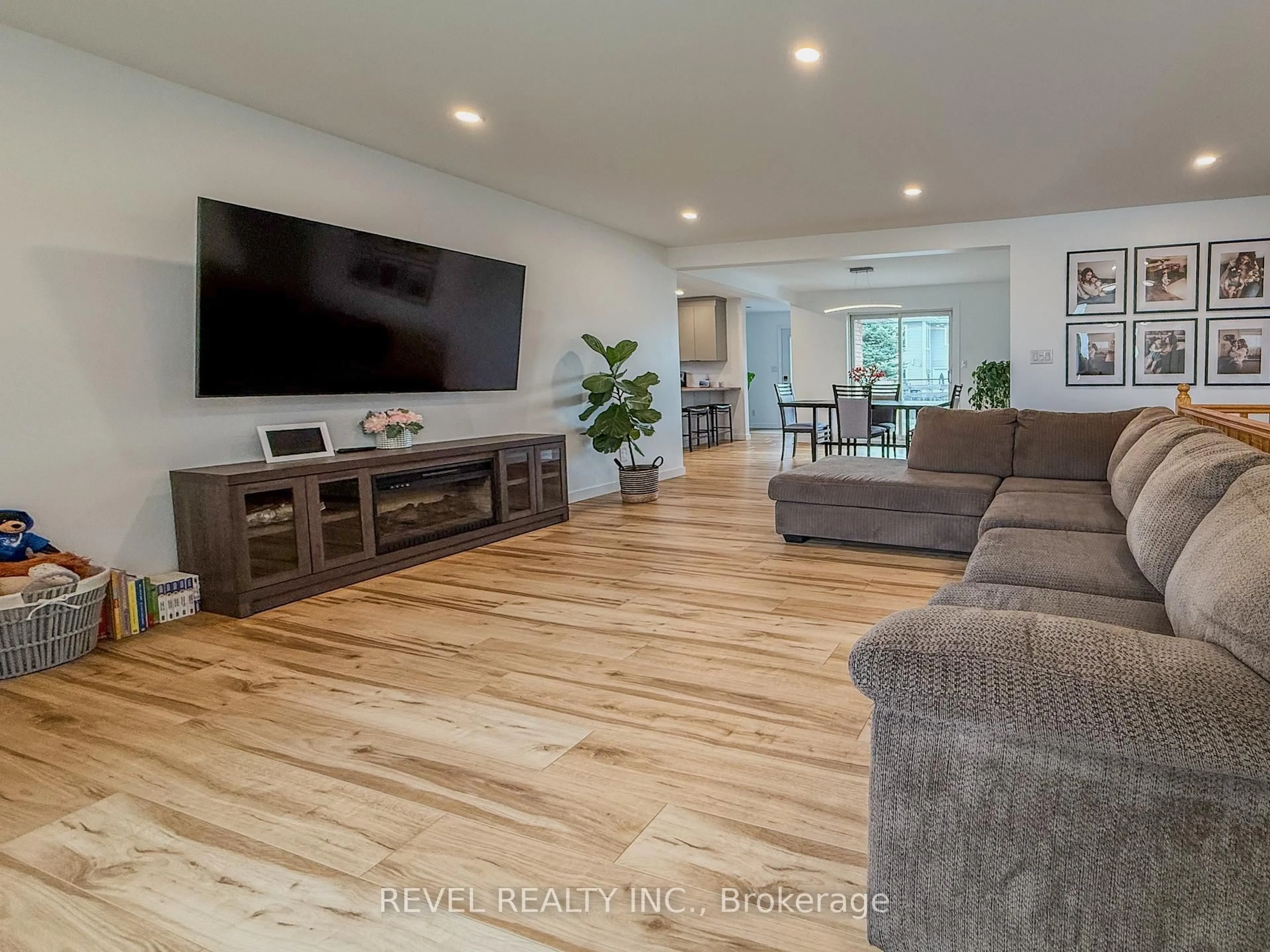 Living room with furniture, wood/laminate floor for 222 Laurentian Cres, Timmins Ontario P4R 1J9
