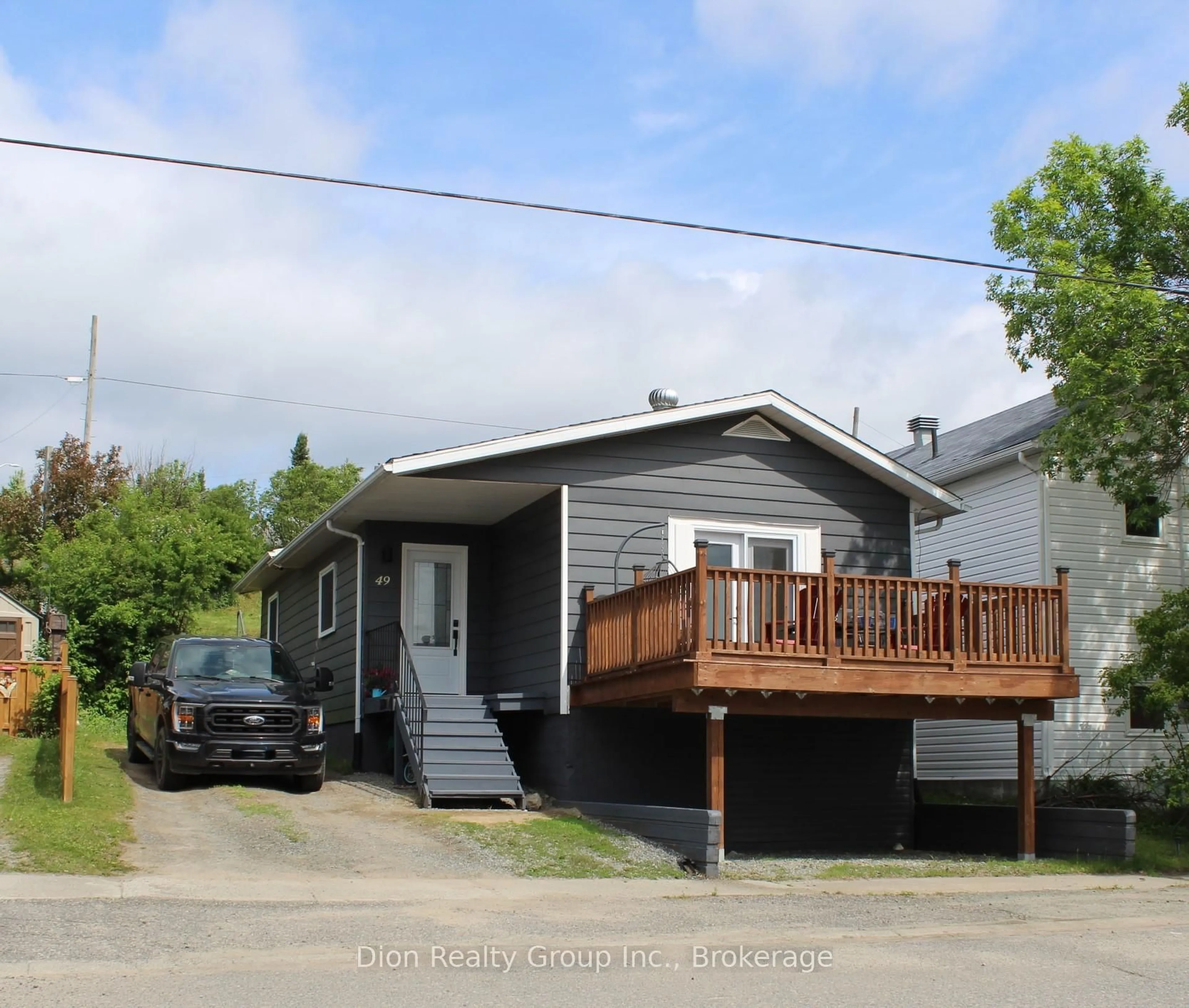 Home with vinyl exterior material, street for 49 Queen St, Kirkland Lake Ontario P2N 2R2