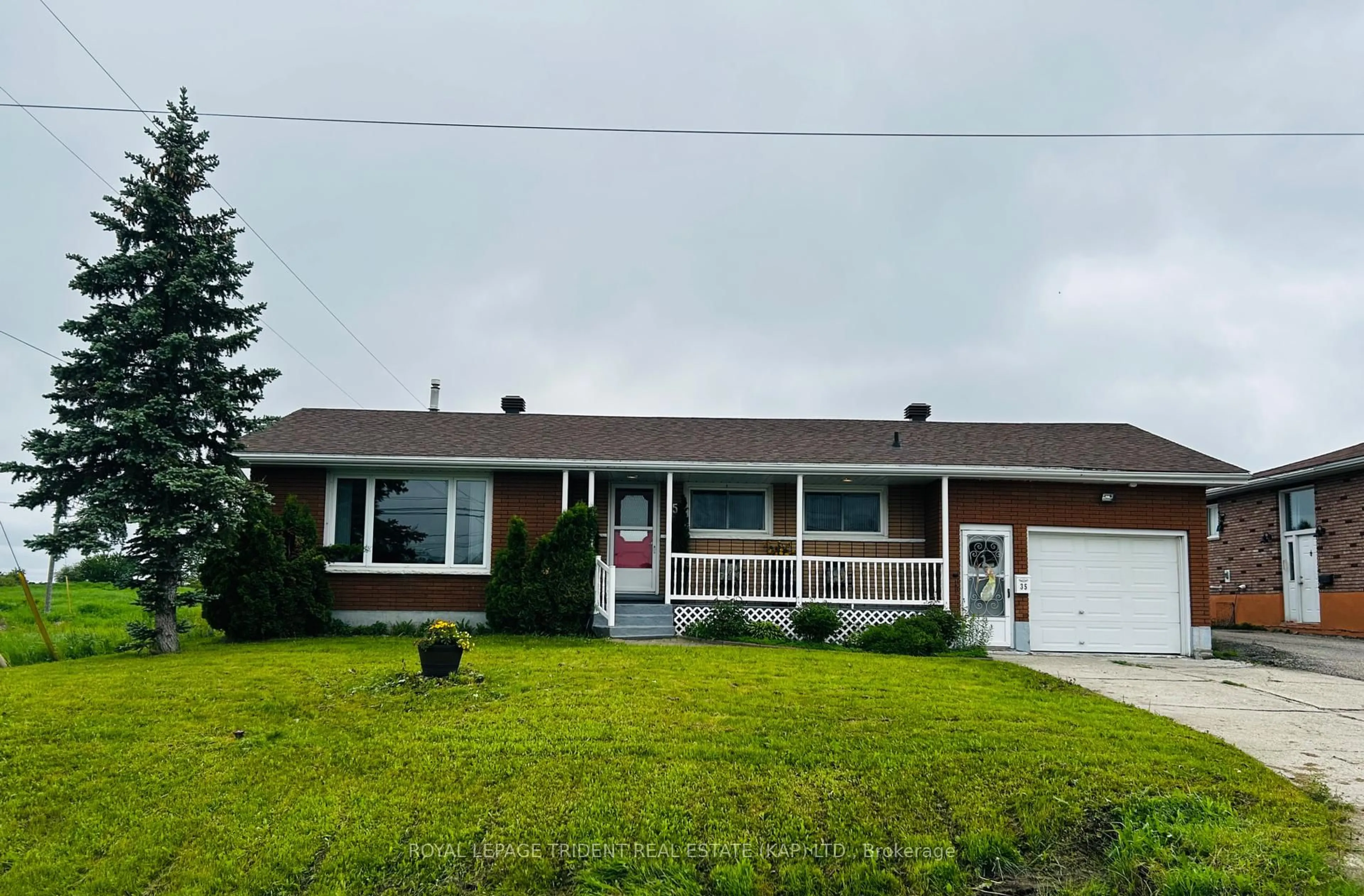 Home with vinyl exterior material, street for 35 Brunelle Rd, Kapuskasing Ontario P5N 2T3