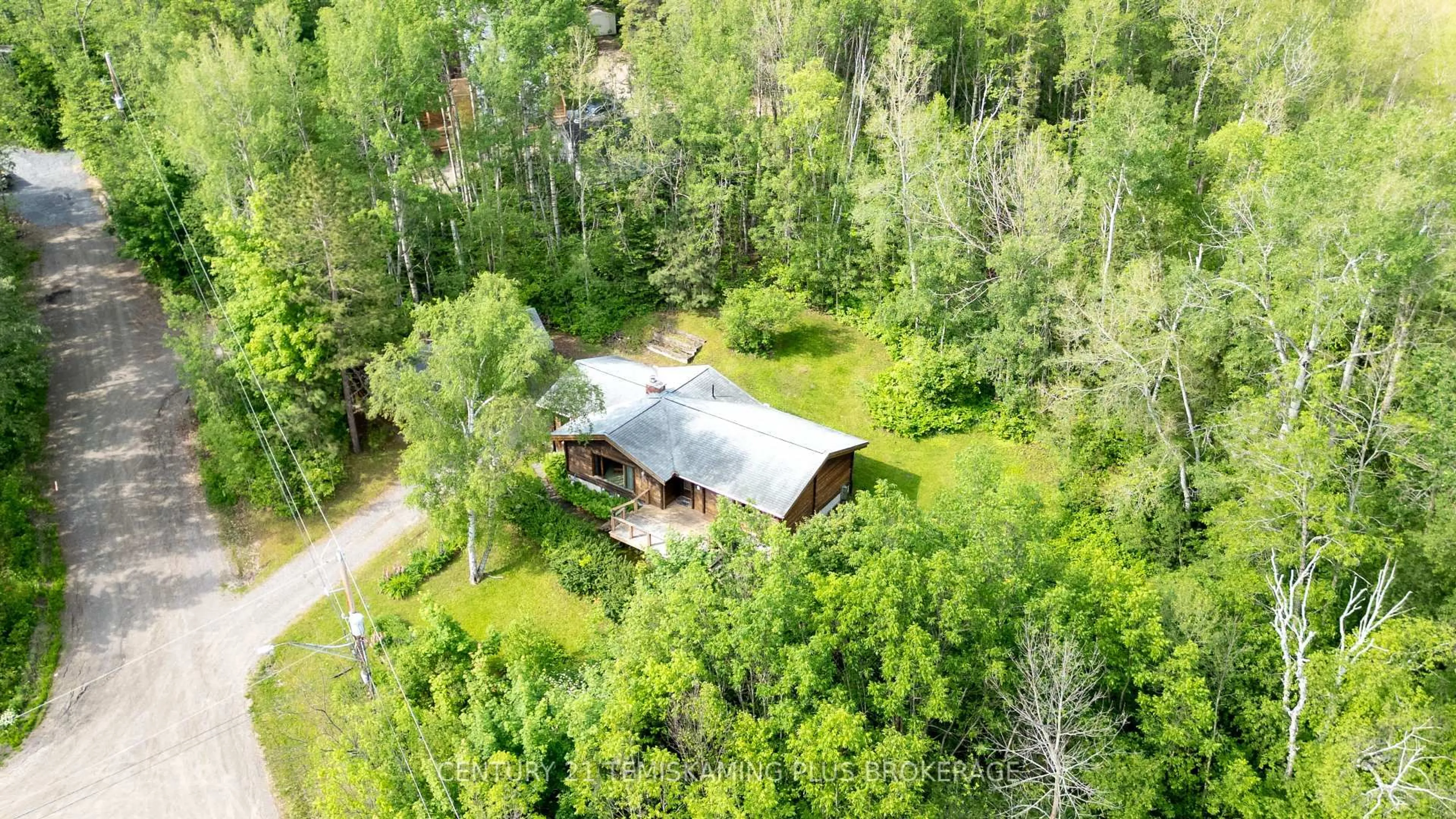 A pic from outside/outdoor area/front of a property/back of a property/a pic from drone, forest/trees view for 10 LOWRY St, Temiskaming Shores Ontario P0J 1H0