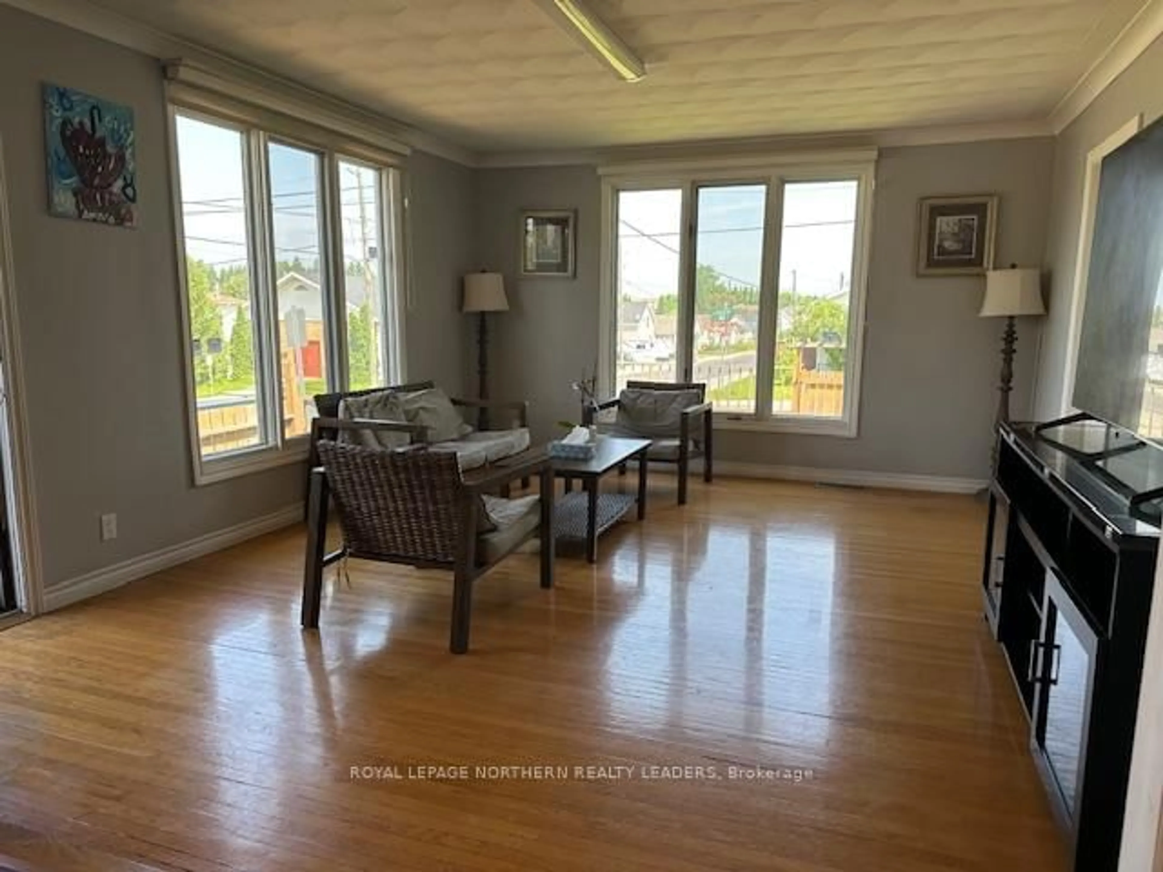 Living room with furniture, wood/laminate floor for 270 Waterloo Rd, Timmins Ontario P4N 4Y1