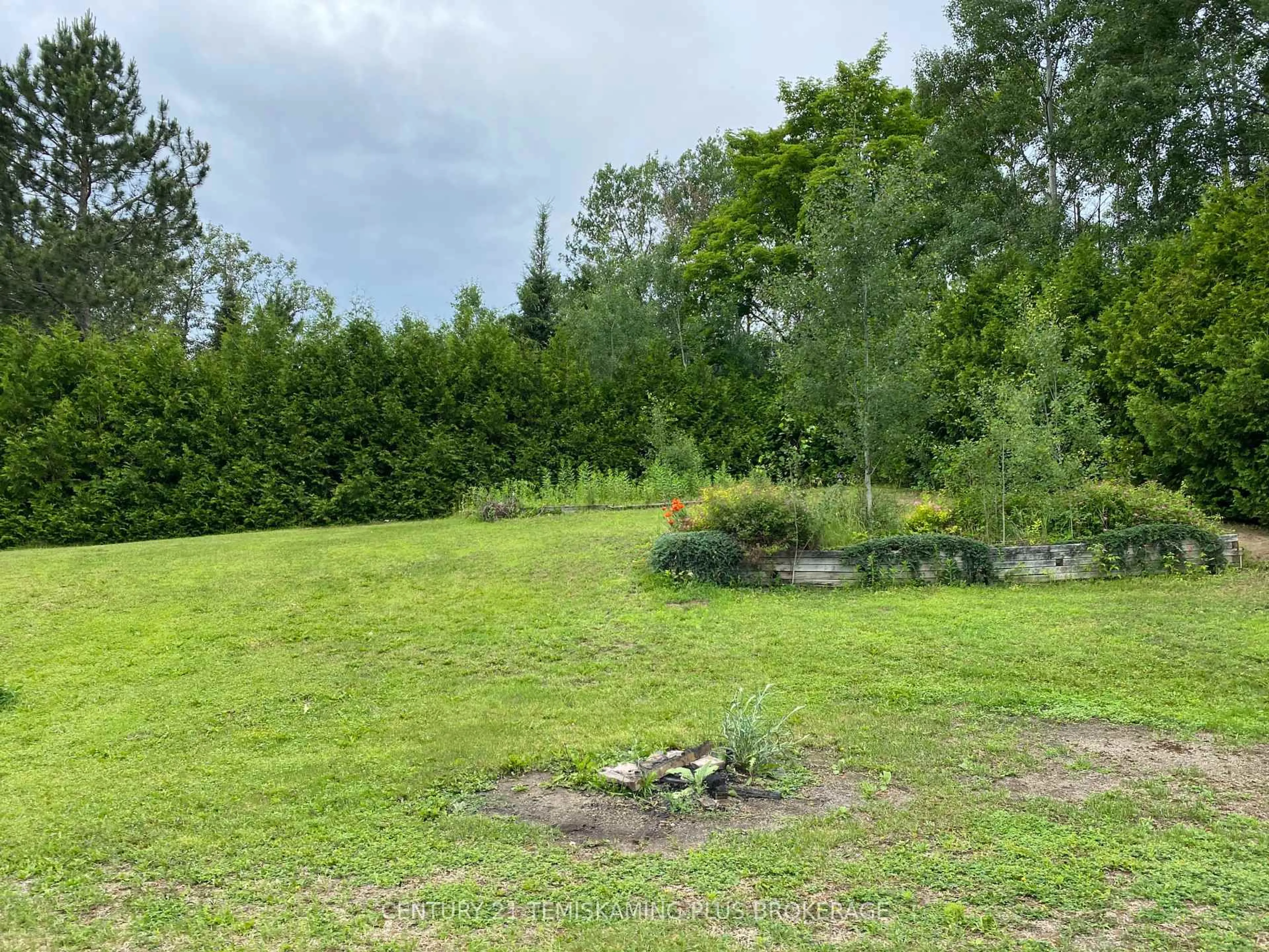 A pic from outside/outdoor area/front of a property/back of a property/a pic from drone, forest/trees view for 858013 Short St, Timiskaming Ontario P0J 1C0