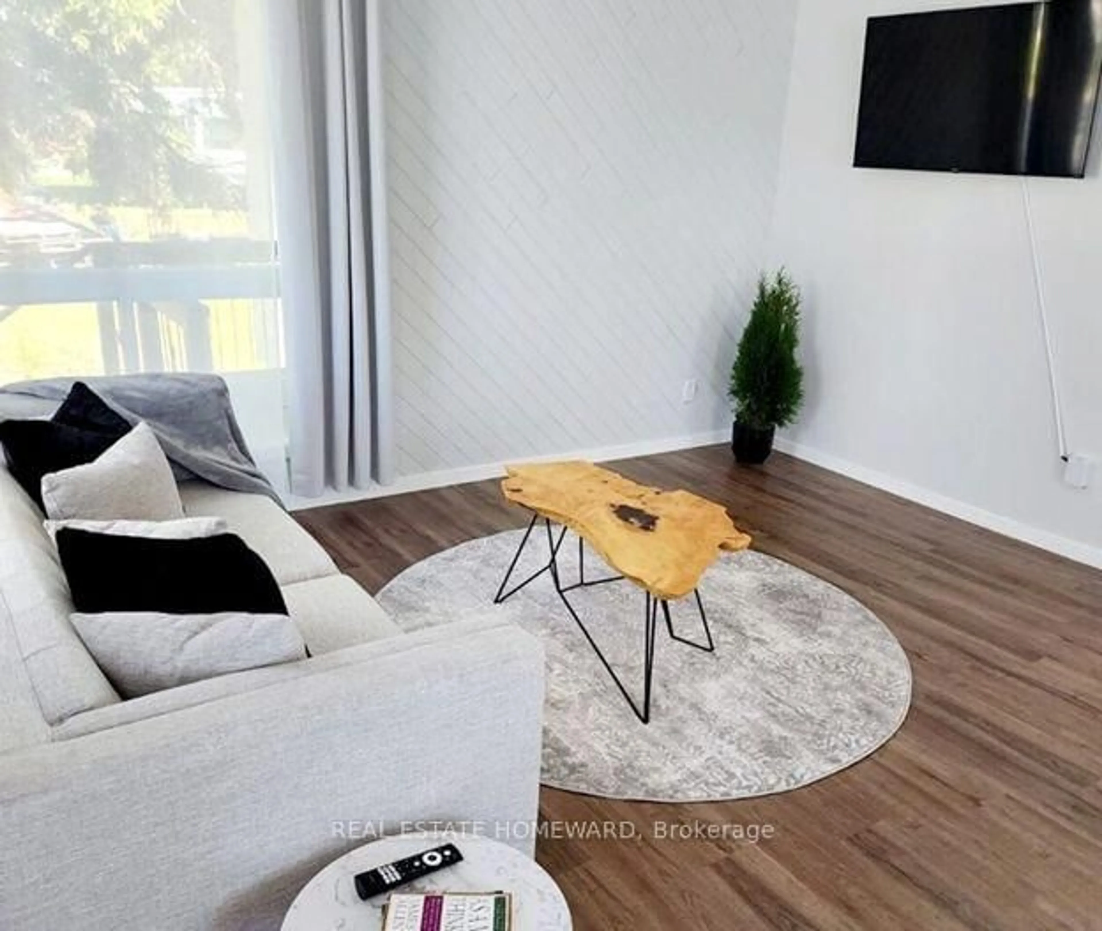 Living room with furniture, wood/laminate floor for 340 Fifth St, Cochrane Ontario P0L 1C0