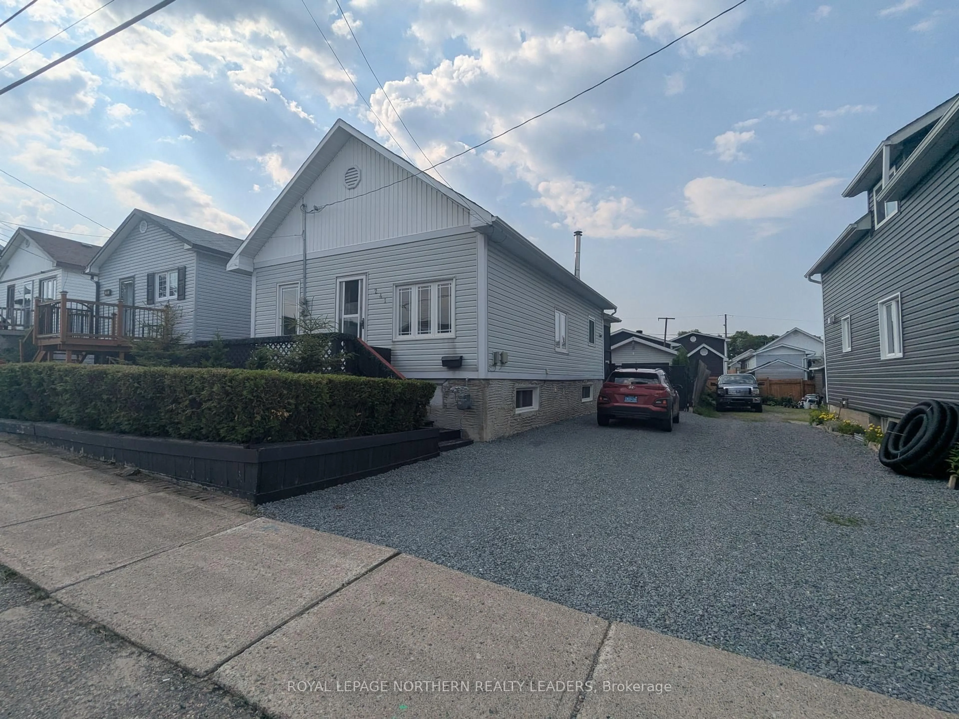A pic from outside/outdoor area/front of a property/back of a property/a pic from drone, street for 241 Commercial Ave, Timmins Ontario P4N 2X5