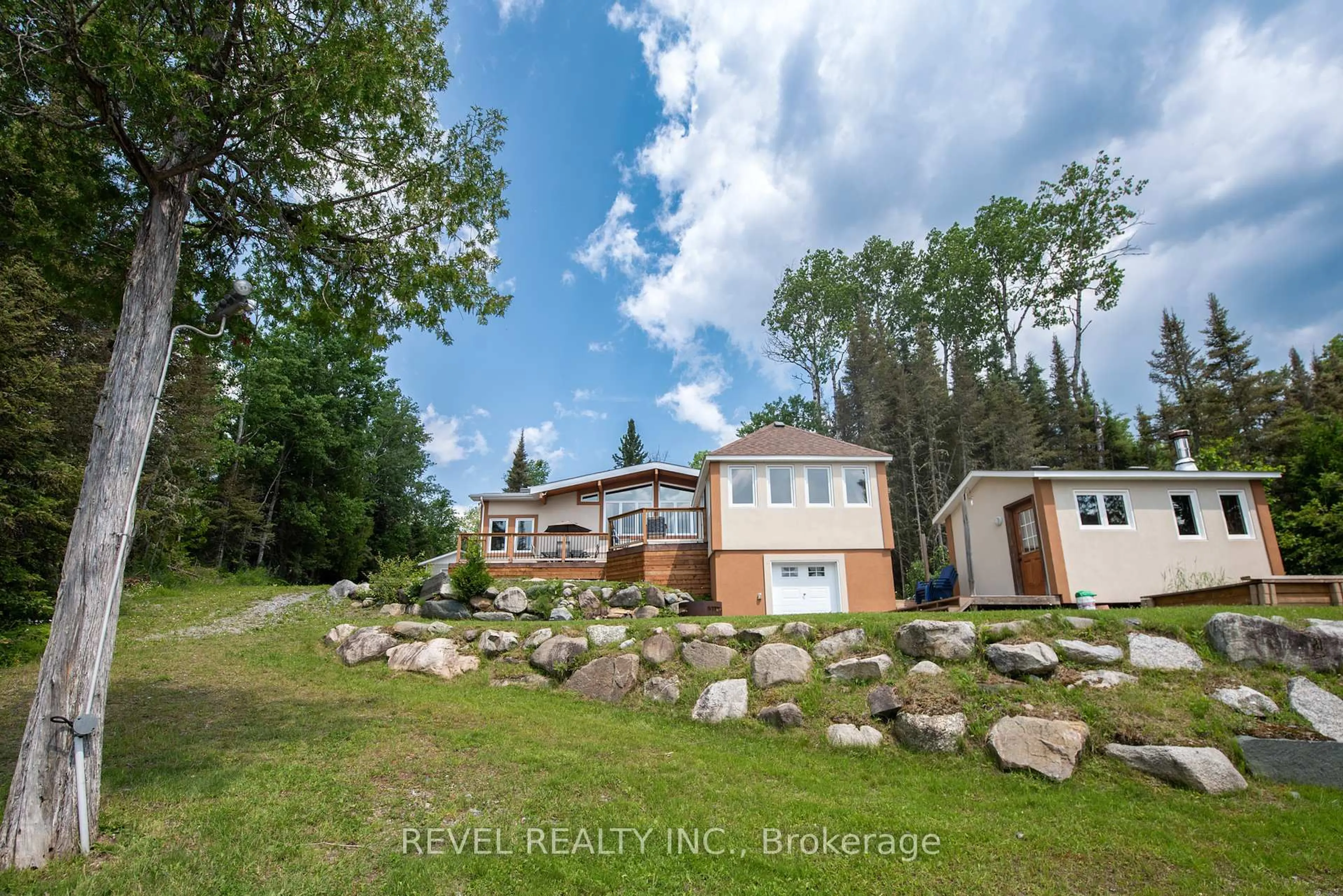 A pic from outside/outdoor area/front of a property/back of a property/a pic from drone, water/lake/river/ocean view for 17 East Bay Rd, Timmins Ontario P4N 7C7