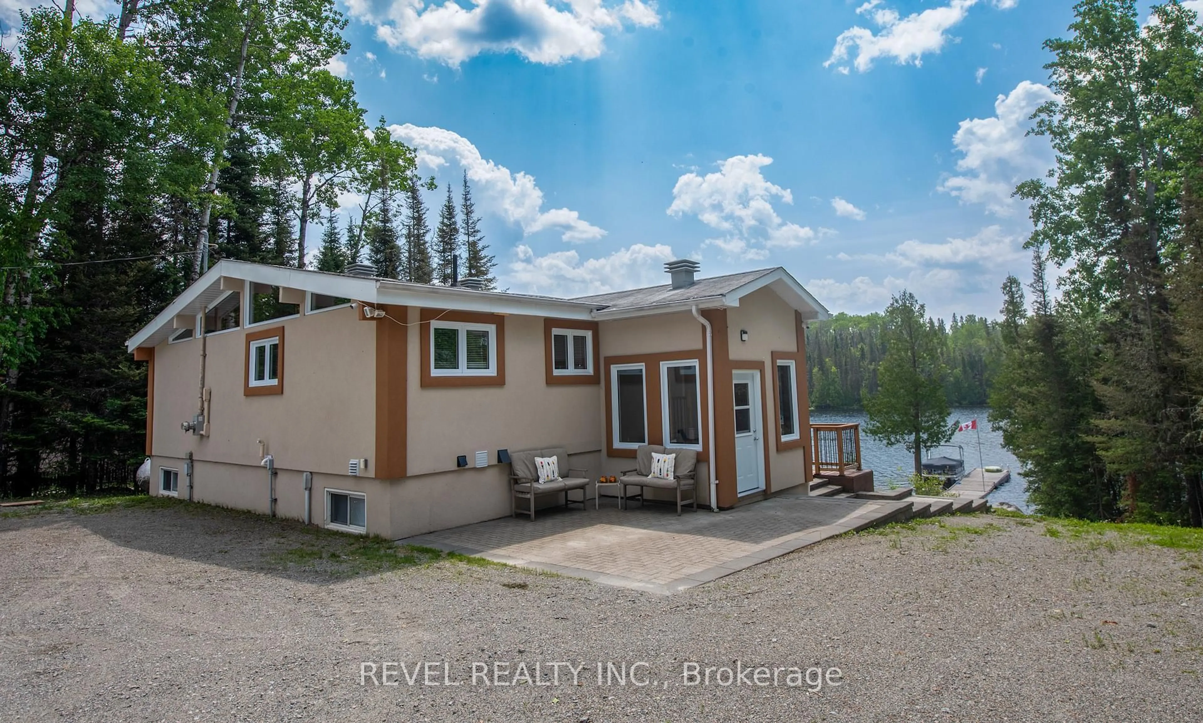 A pic from outside/outdoor area/front of a property/back of a property/a pic from drone, water/lake/river/ocean view for 17 East Bay Rd, Timmins Ontario P4N 7C7