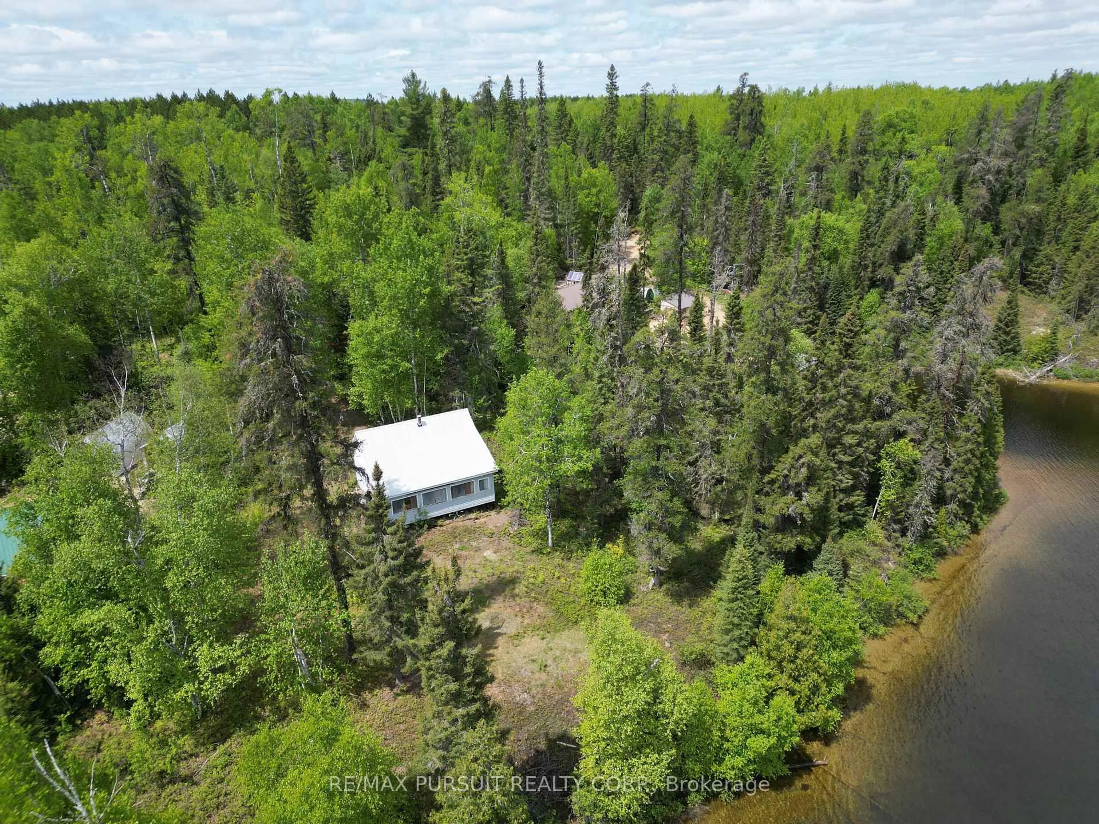 A pic from outside/outdoor area/front of a property/back of a property/a pic from drone, water/lake/river/ocean view for 425 Bouchard Rd, Kirkland Lake Ontario P0K 1N0