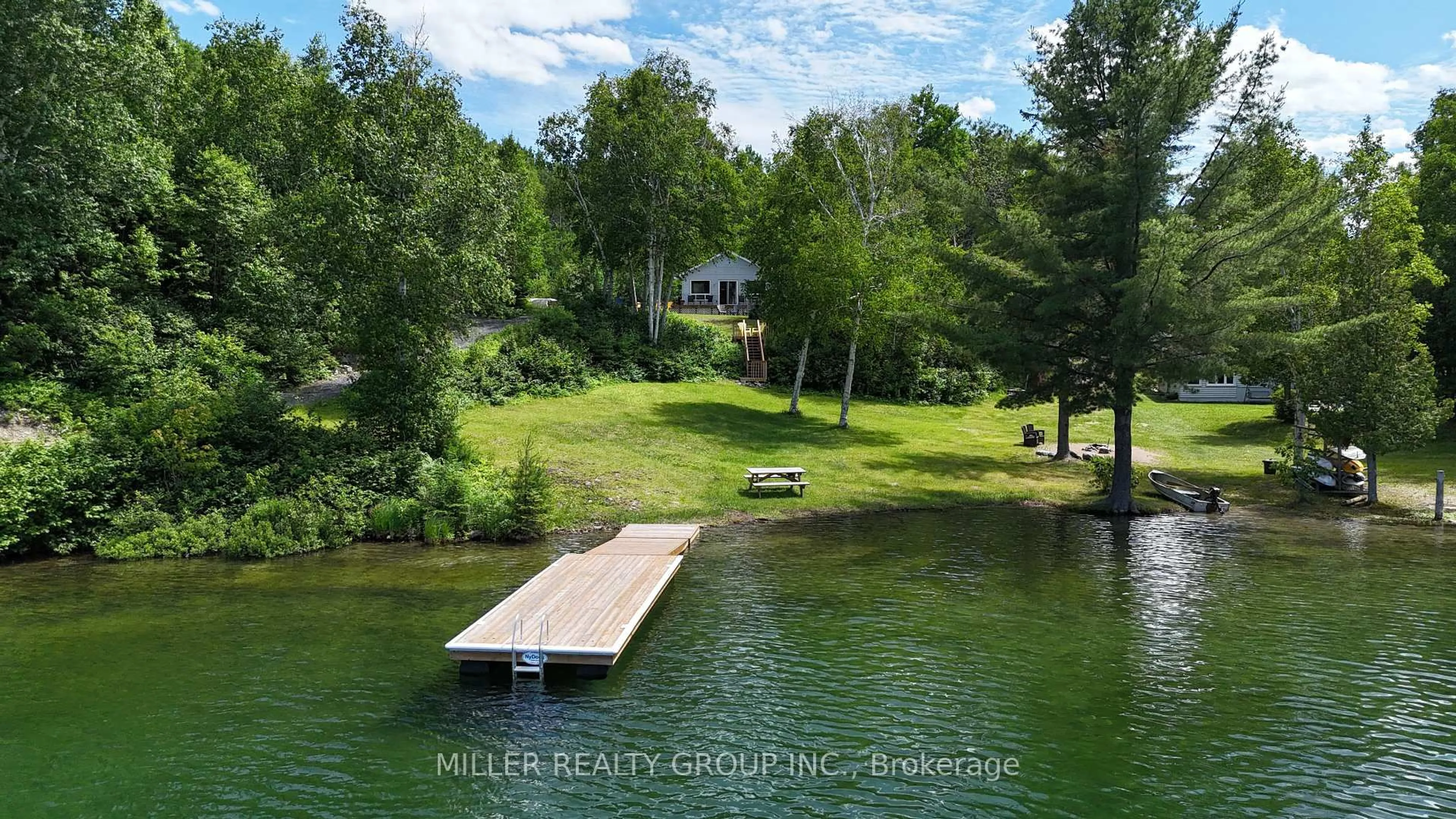 A pic from outside/outdoor area/front of a property/back of a property/a pic from drone, water/lake/river/ocean view for 877501 Bass Lake Rd, Coleman Ontario P0J 1C0