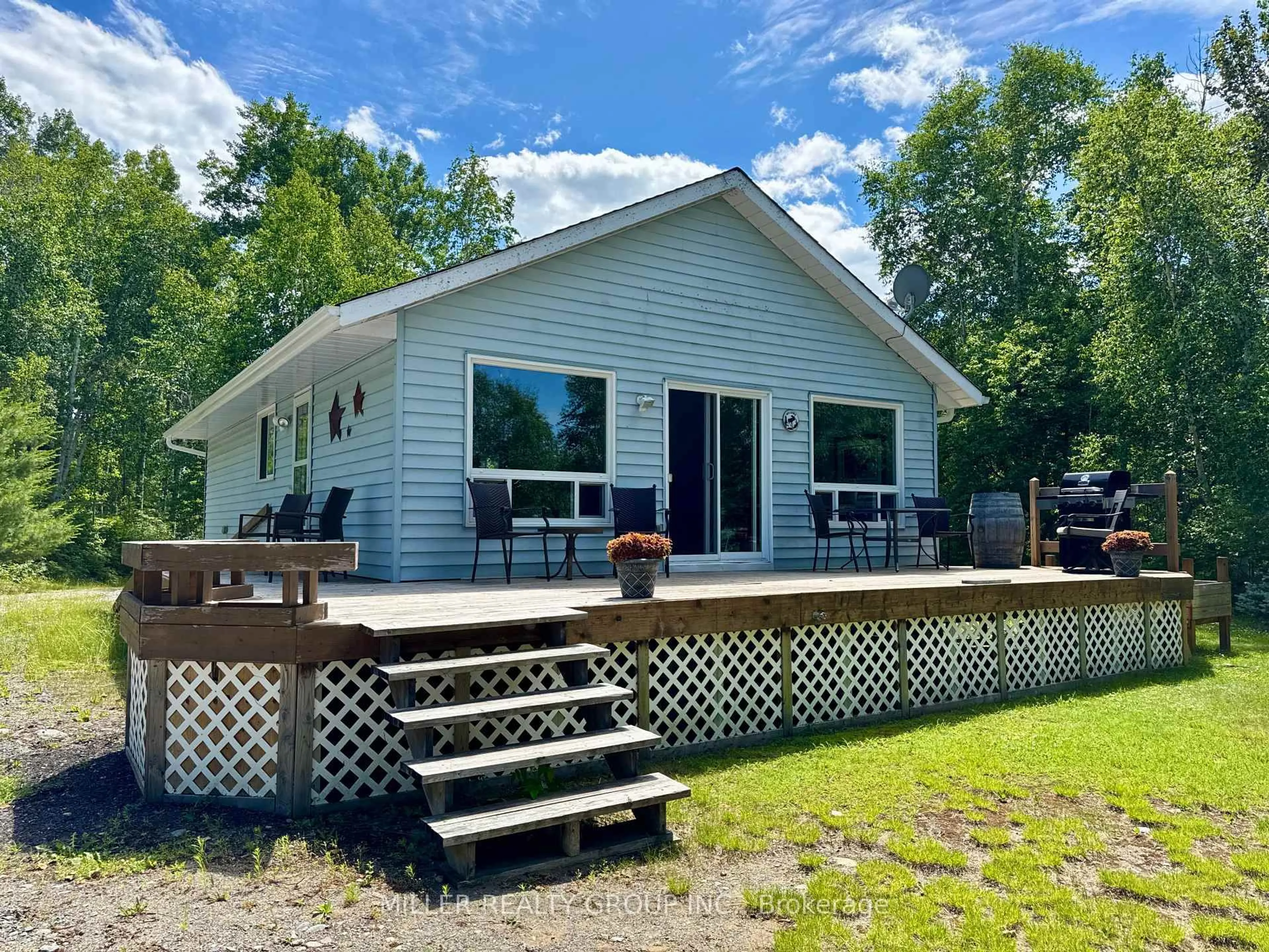 A pic from outside/outdoor area/front of a property/back of a property/a pic from drone, water/lake/river/ocean view for 877501 Bass Lake Rd, Coleman Ontario P0J 1C0