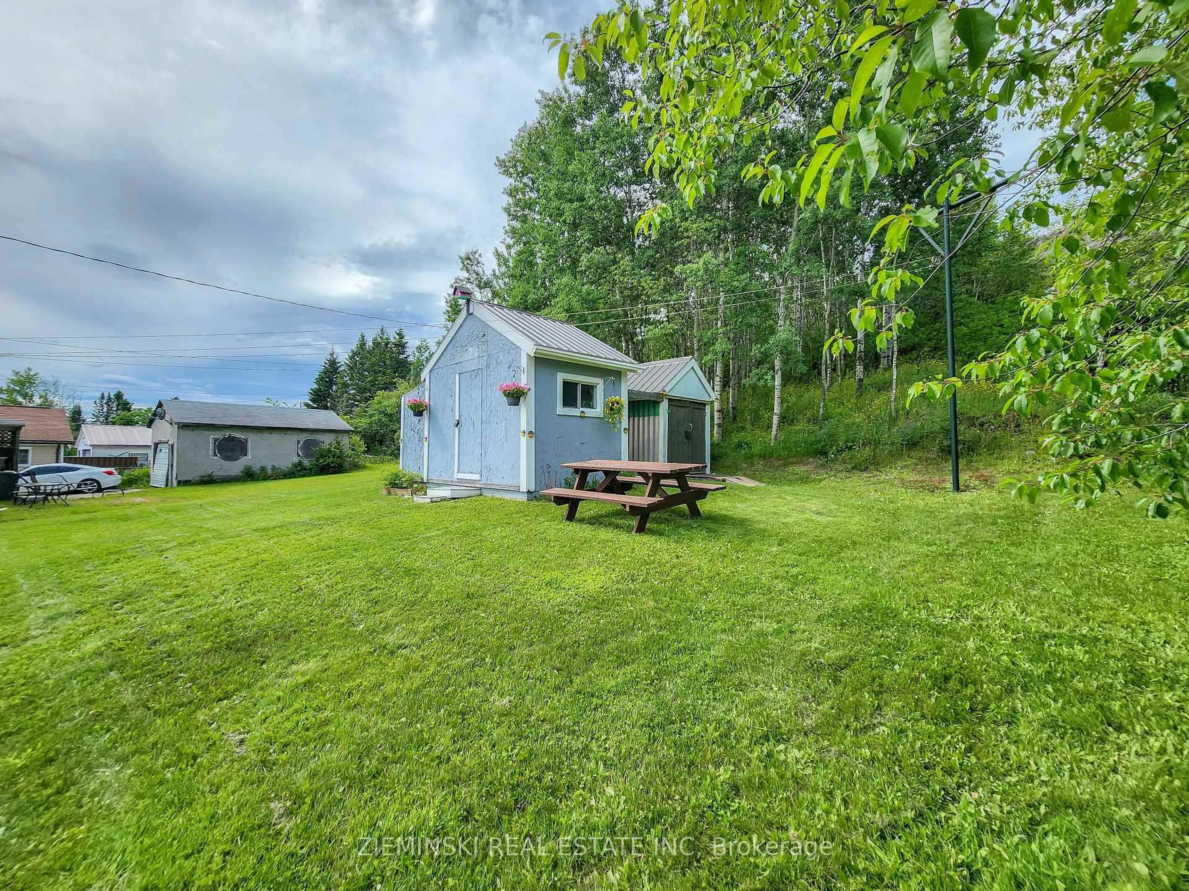 A pic from outside/outdoor area/front of a property/back of a property/a pic from drone, water/lake/river/ocean view for 142 Anson Dr, Iroquois Falls Ontario P0K 1E0