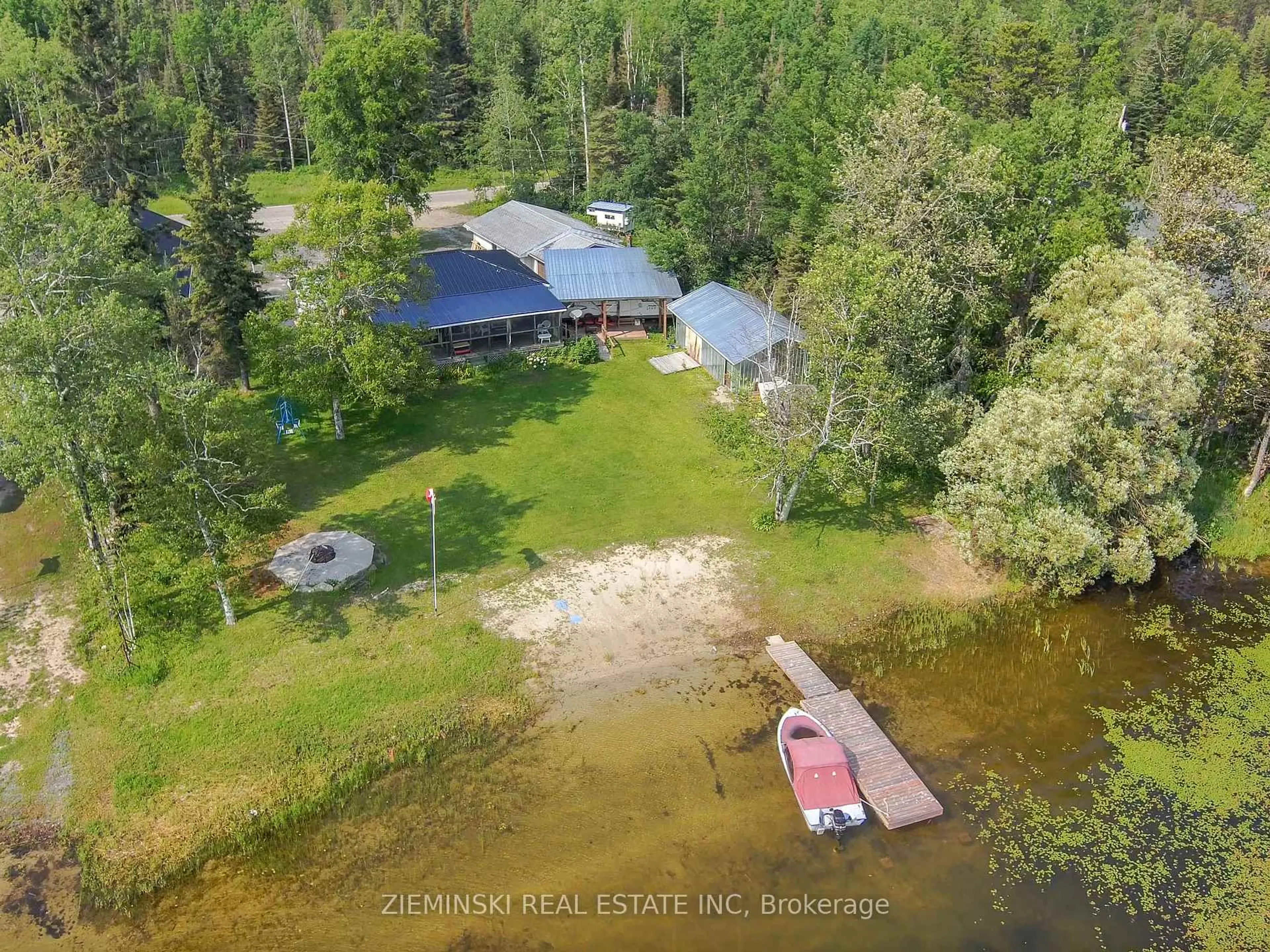 A pic from outside/outdoor area/front of a property/back of a property/a pic from drone, water/lake/river/ocean view for 234 Nellie Lake Rd, Iroquois Falls Ontario P0K 1G0