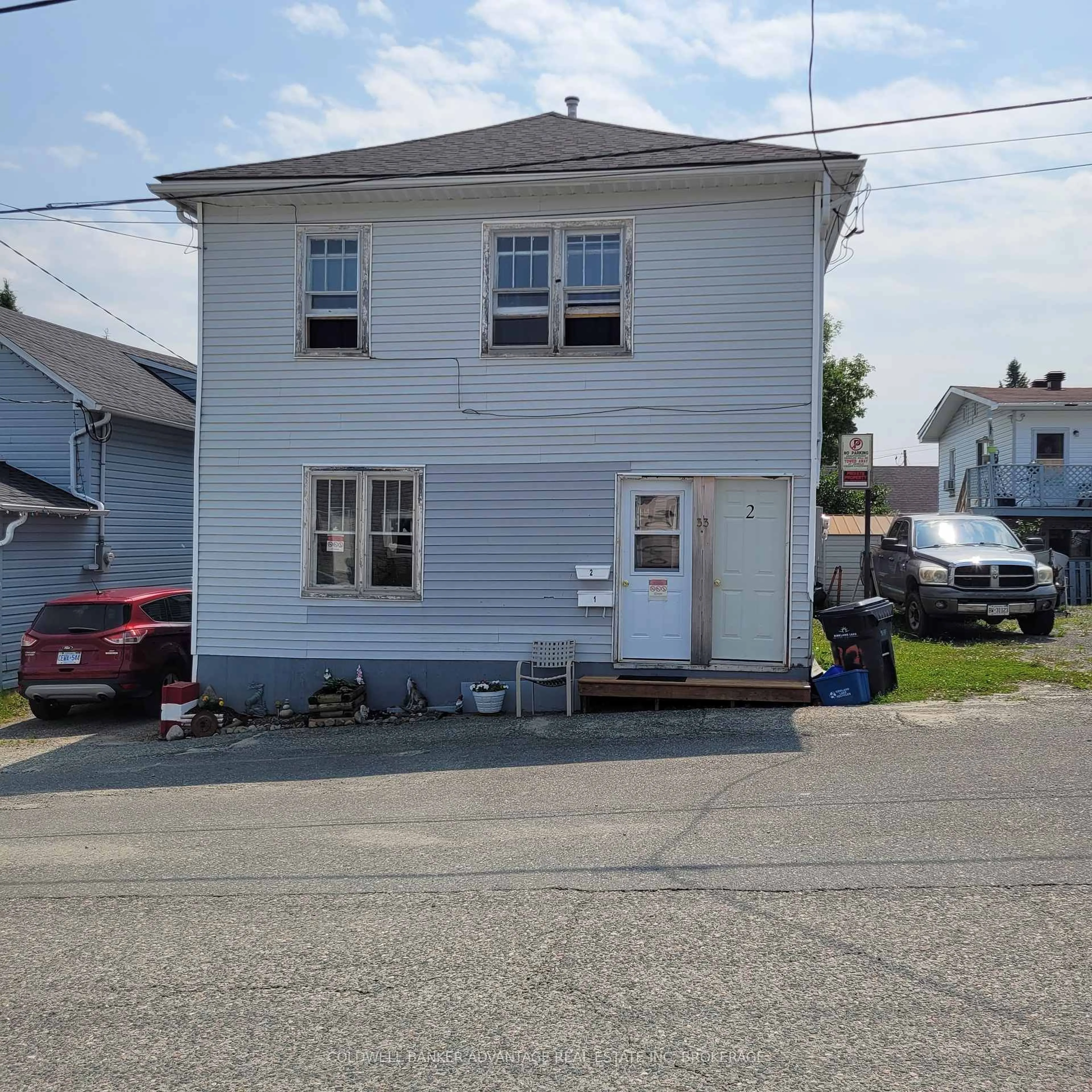 Home with vinyl exterior material, street for 33 Kirkpatrick St, Kirkland Lake Ontario P2N 2H1