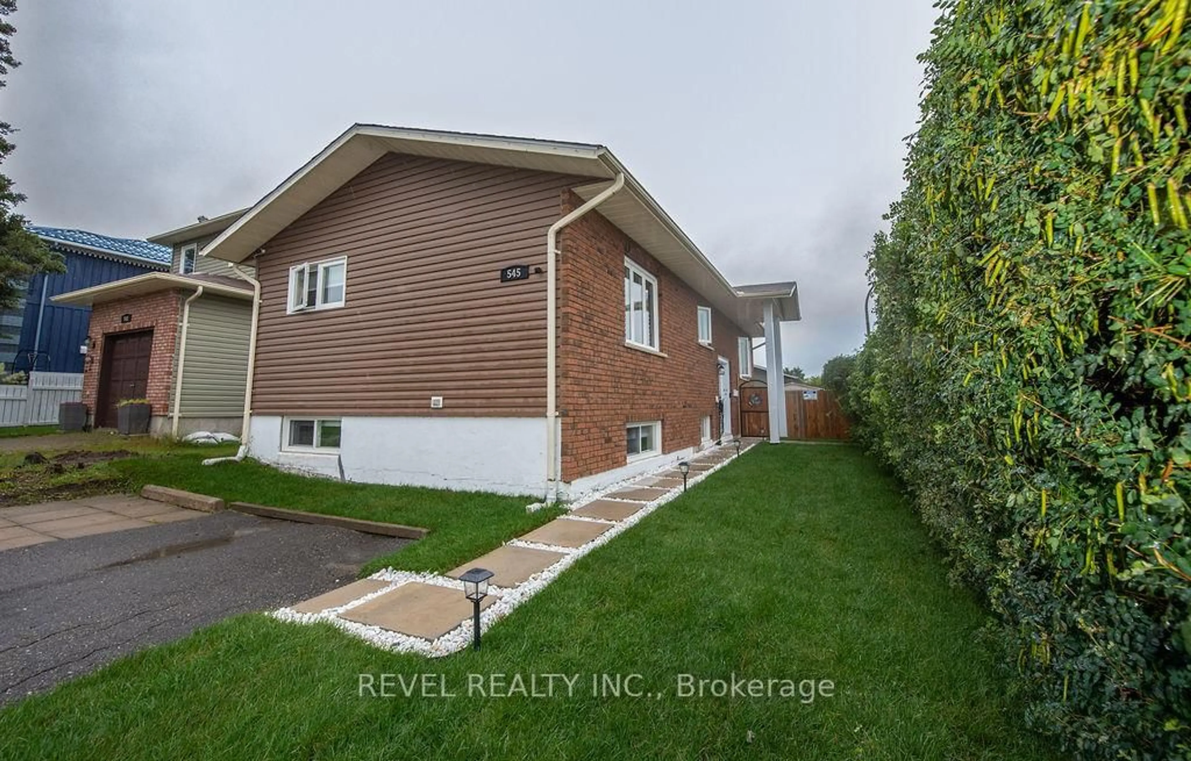 Home with vinyl exterior material, street for 545 Lonergan Blvd, Timmins Ontario P4P 1C8